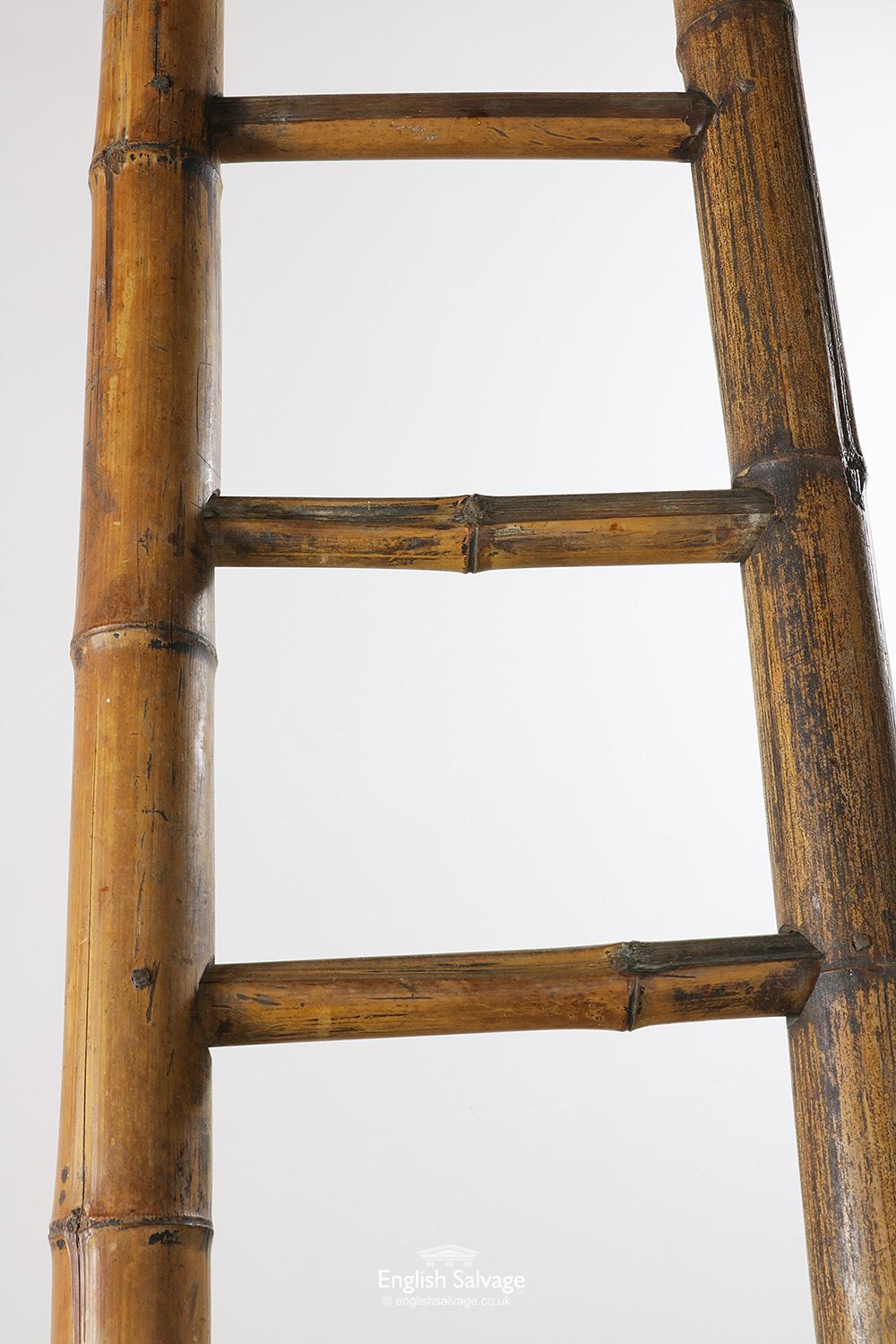 Vintage bamboo ladder which would make a great product display piece in a shop or kitchen. The ladder is 45cm wide at the base and tapers up to 27cm wide at the top. Some splits and chips present, decorative use only.