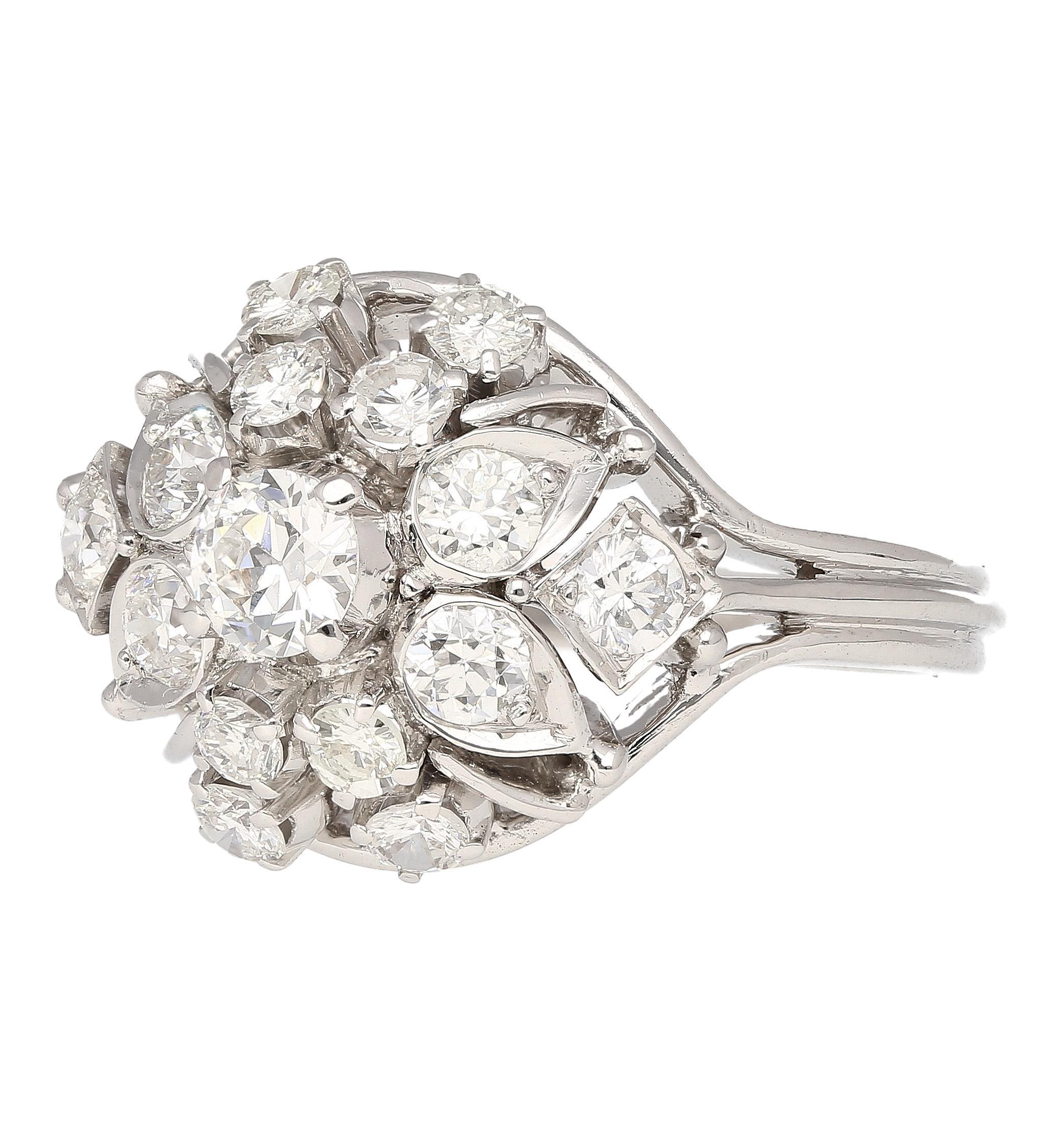 This captivating ring blends vintage charm with modern sparkle. A mesmerizing 0.30 carat, vintage old European cut diamond takes center stage. The center stone is embraced by a descending halo of 14 round diamonds of 1 carat tw. The intricate design