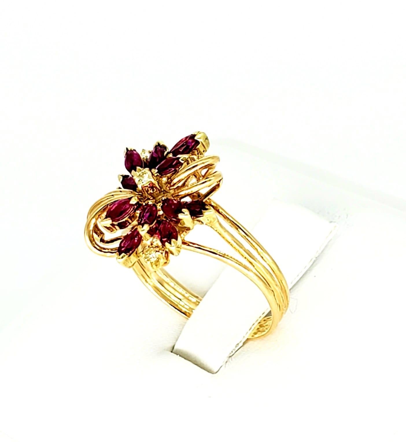 Vintage 1.30 Carat Ruby & Diamonds Flower Cluster Ring. The ring features a flower design very with marquise shaped Ruby’s weighing approx 1.10 carat and round diamonds weighting approx 0.10 carat. The ring is a size 6.5 and is made of 14k solid