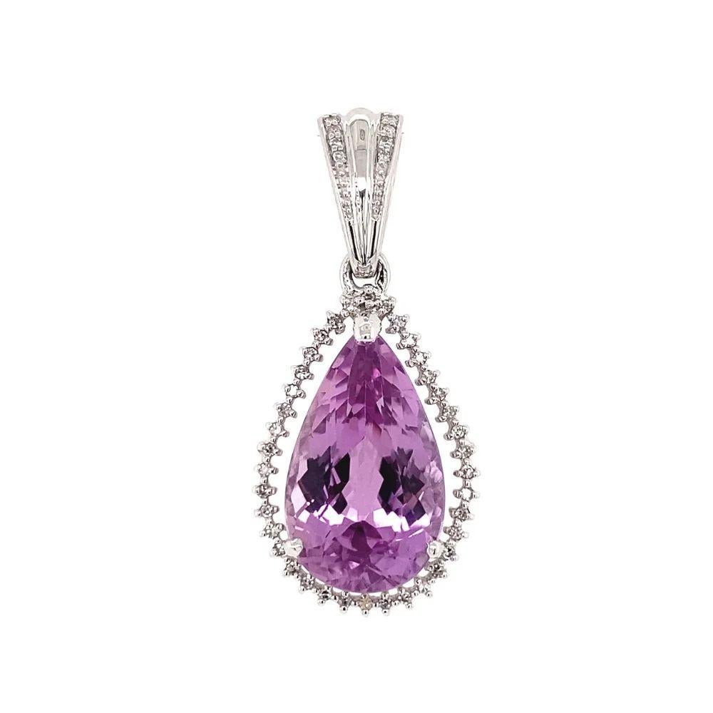 Simply Beautiful! Elegant and finely detailed Pear shaped Vivid Pink Kunzite and Diamond Pendant. Featuring a 13.32 Carat Pear shaped Vivid Pink Kunzite Gemstone. Surrounded by Diamonds weighing approx. 0.19tcw. Hand crafted in 18K White Gold,