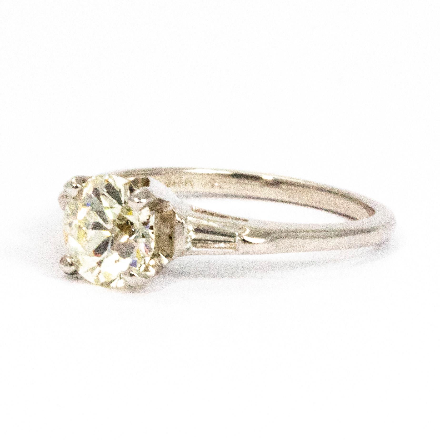 Gorgeous baguette diamonds sit on the shoulders of this absolutely stunning ring. The centre stone is a wonderful K colour and measures 1.35carat. It is a gorgeous size and has a lovely sparkle to it. Modelled in white gold.

Ring Size: N or 6 3/4