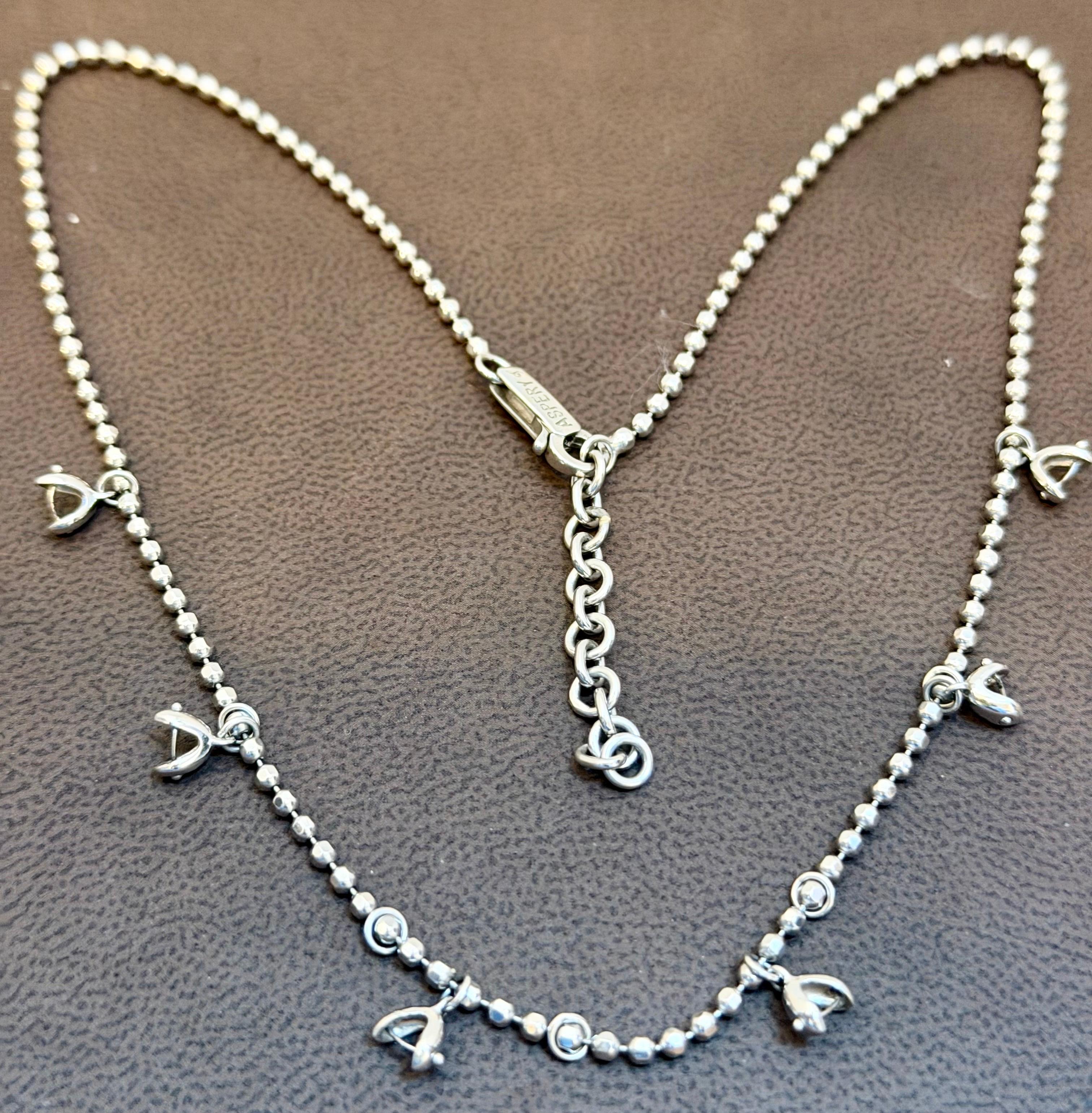 Vintage 13.5 Gm 18 Karat White Gold 6 Hanging Station Chain By designer Aspery
La chaîne peut être portée de 16 à 18 pouces de long car elle comporte plusieurs maillons à l'extrémité.

6  Stations d'accrochage , 
Or 18 K K 13,5   Grammes
La plupart