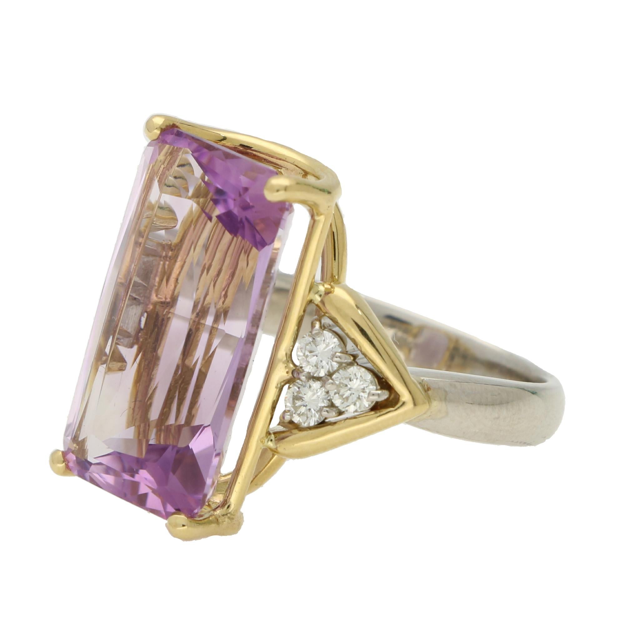A highly unique vintage amethyst and diamond cocktail ring set in 18k yellow gold and platinum. 

The ring is centrally set with a beautiful rectangular mixed cut amethyst stone which is securely four claw set in an open yellow gold setting. The