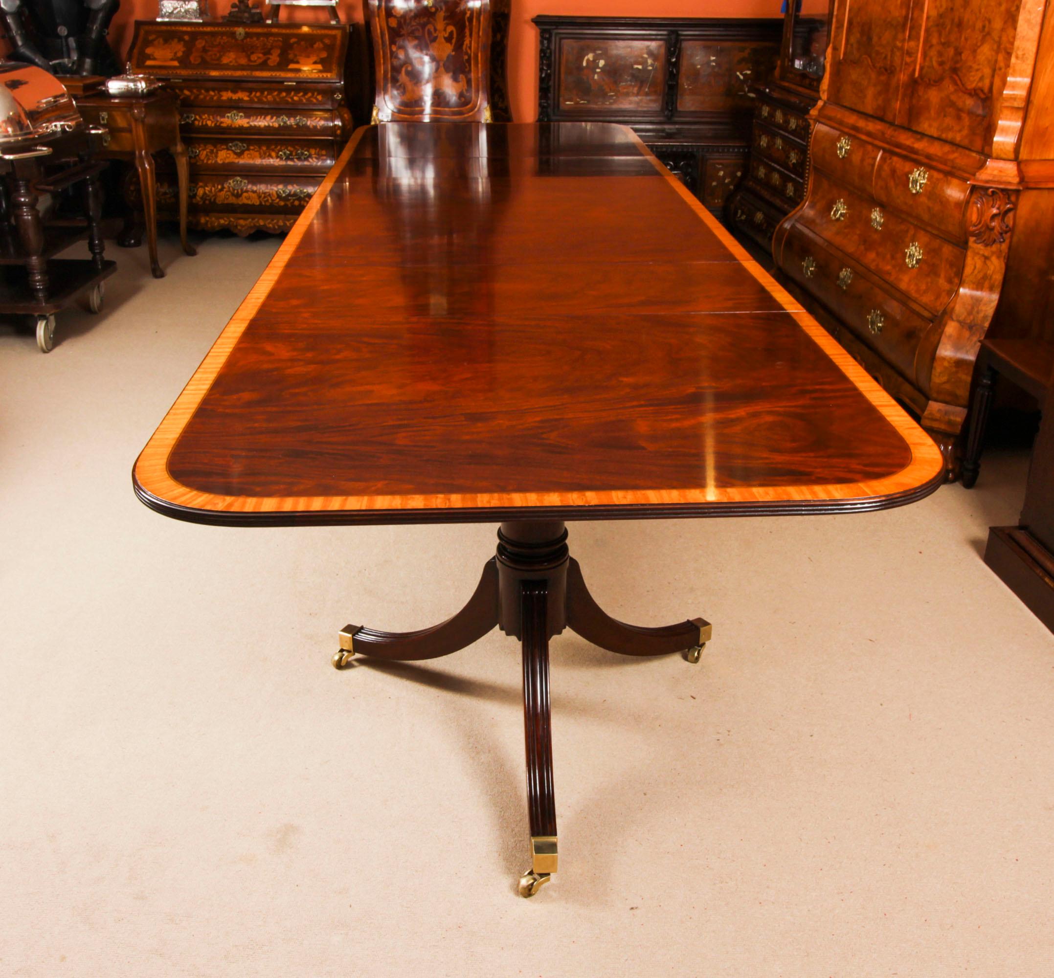 Vintage 13ft Three Pillar Mahogany Dining Table with 14 Chairs 20th C In Good Condition For Sale In London, GB