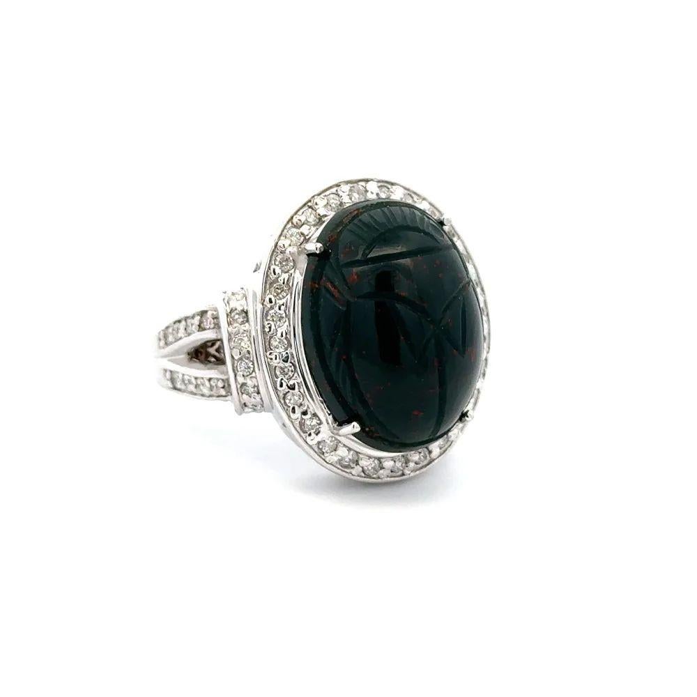 Simply Beautiful! Finely detailed Vintage Red Carpet Solitaire Bloodstone Scarab and Diamond Gold Statement Ring. Centering a securely nestled Hand set 14 Carat Oval Bloodstone Scarab, surrounded by Round Brilliant Cut Diamonds, weighing approx.