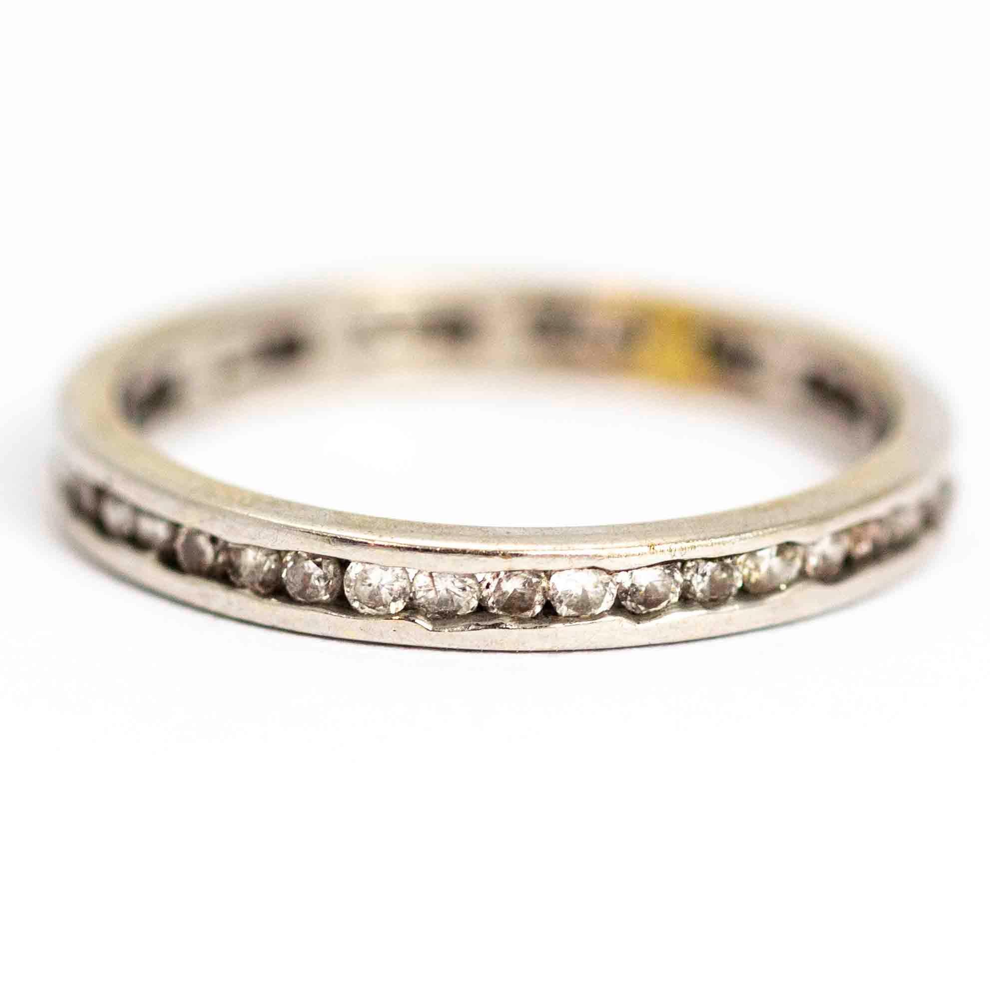 A superb vintage eternity band fully set with round white diamond. The stones are deep set between the edges of the ring. Modelled in 14 carat white gold.

Ring Size: UK N, US 7

Band Width: 2.55mm

Depth to Finger: 1.42mm