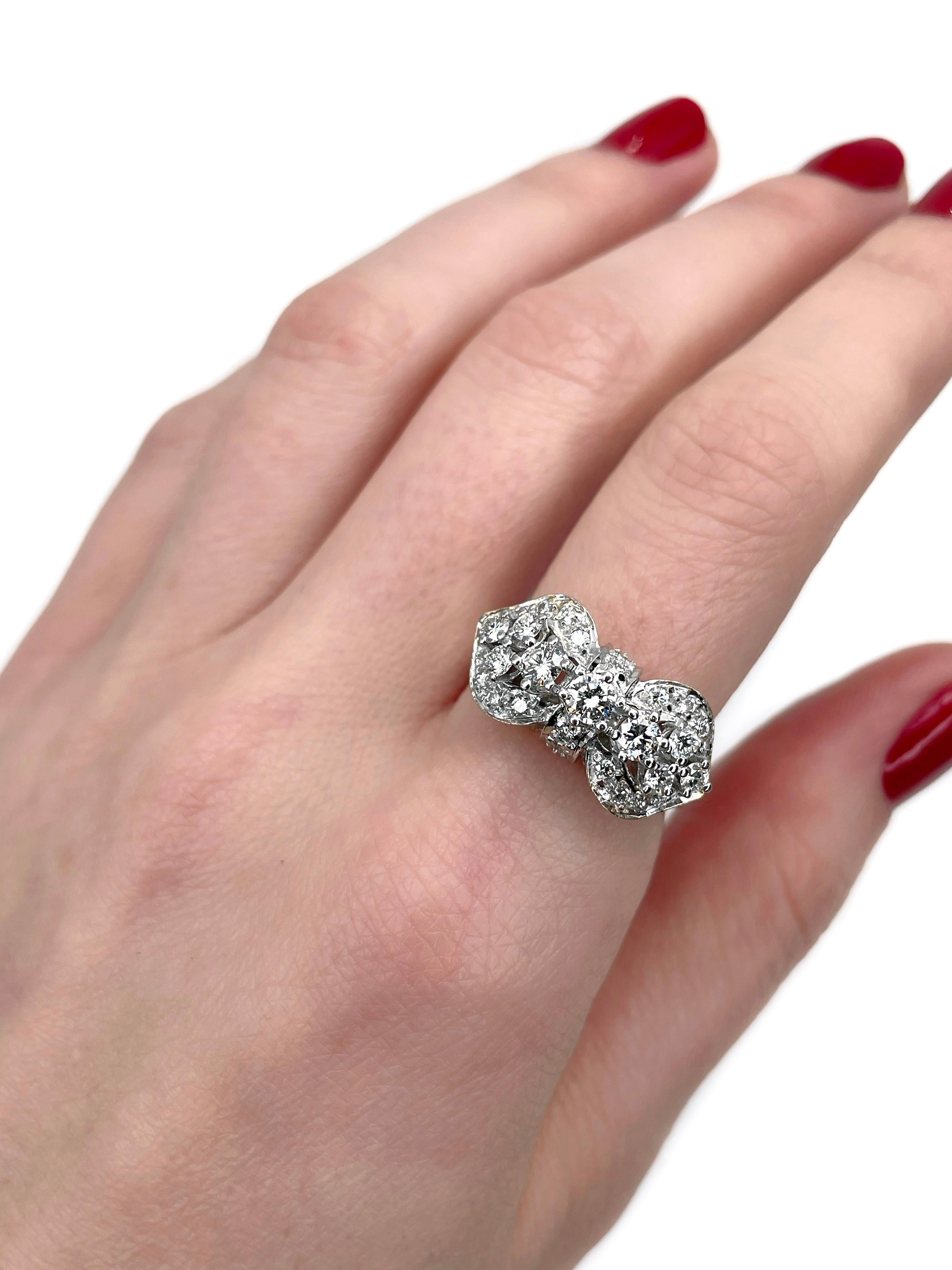This is a vintage bow shape cocktail ring crafted in 14K gold. Circa 1970. 

The piece features diamonds (TW 0.96ct):
- 9 round brilliant cut, TW 0.70ct, RW+/W, VS-SI
- 18 round brilliant cut, TW 0.26ct, RW+/W, VS-SI

Signed with “585”

Weight: