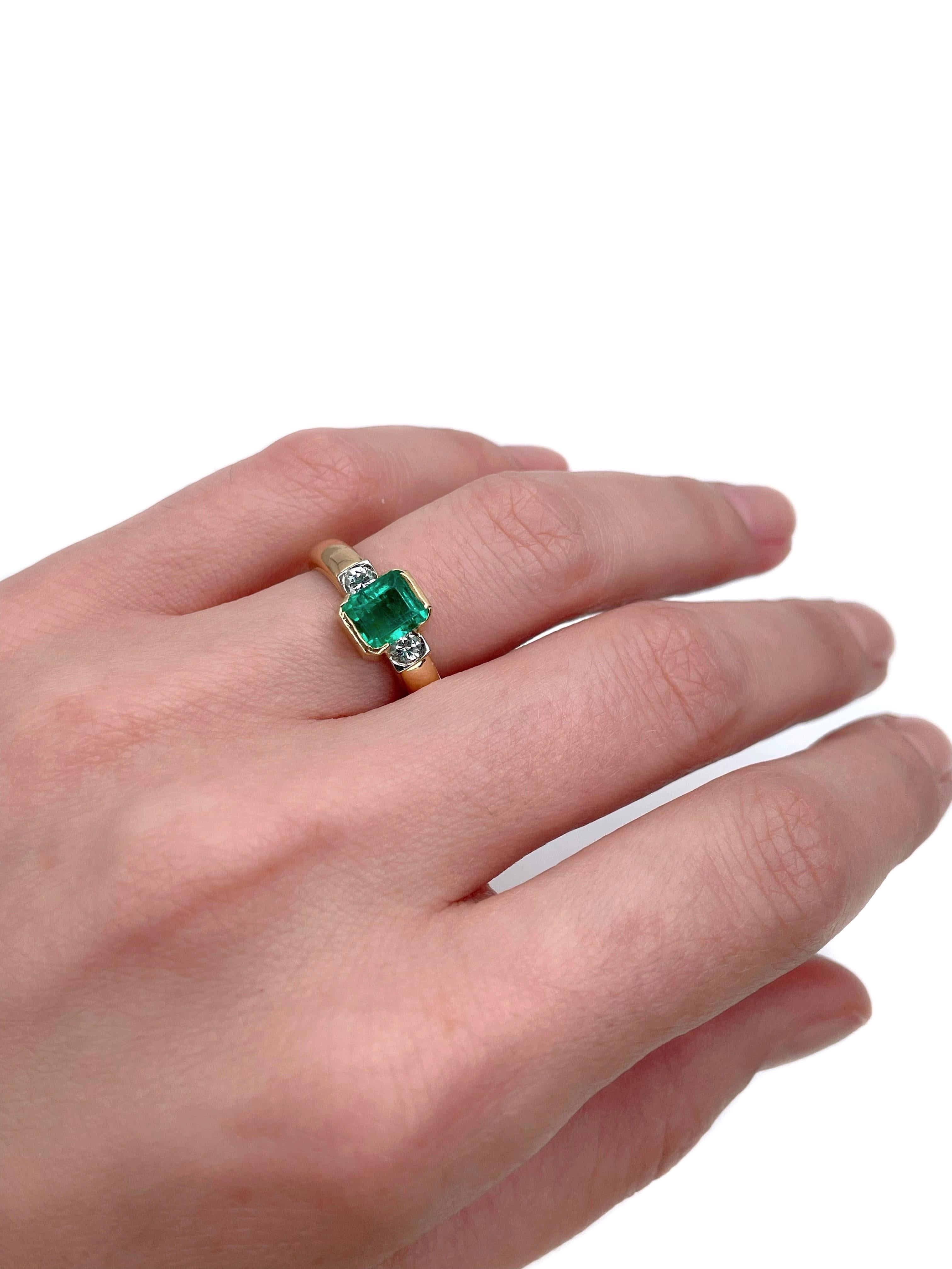 This is a vintage three-stone ring crafted in 14K yellow gold. Circa 1980. 

It features:
- 1 emerald (emerald cut, 1.10ct, vslbG 5/5, SI)
- 2 diamonds (round brilliant cut, TW 0.21ct, RW-W, VS)

Weight: 6.27g
Size: 16 (US 5.5)

IMPORTANT: please