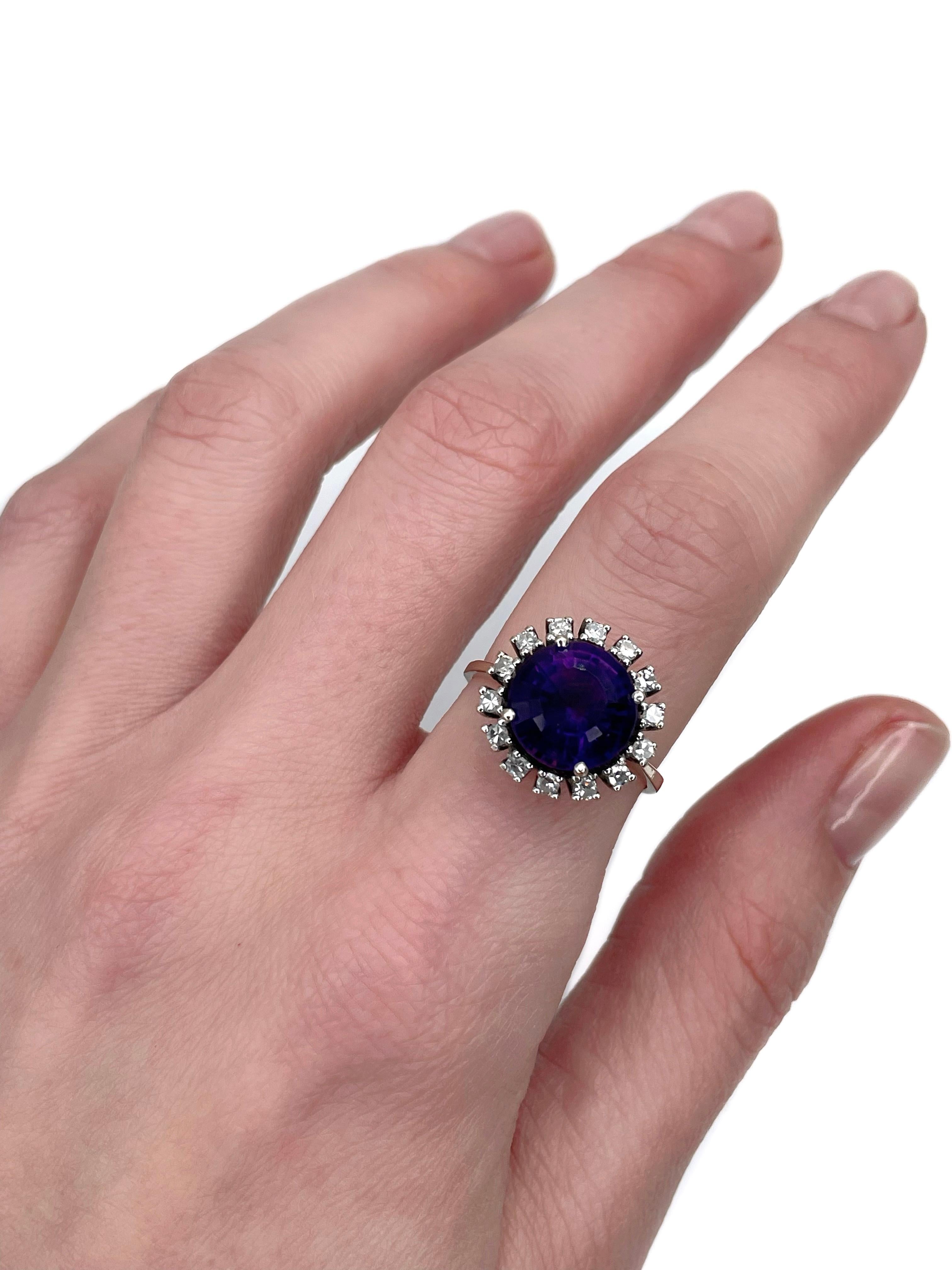 This is a vintage cluster ring crafted in 14K white gold. Circa 1980.

It features:
- 1 amethyst, round cut, 3.80ct, P 6/4, P1
- 14 diamonds, RBC-17, TW 0.30ct, RW+/W, VS-SI

Weight: 4.79g
Size: 17.5 (US 7.25)

IMPORTANT: please ask about the