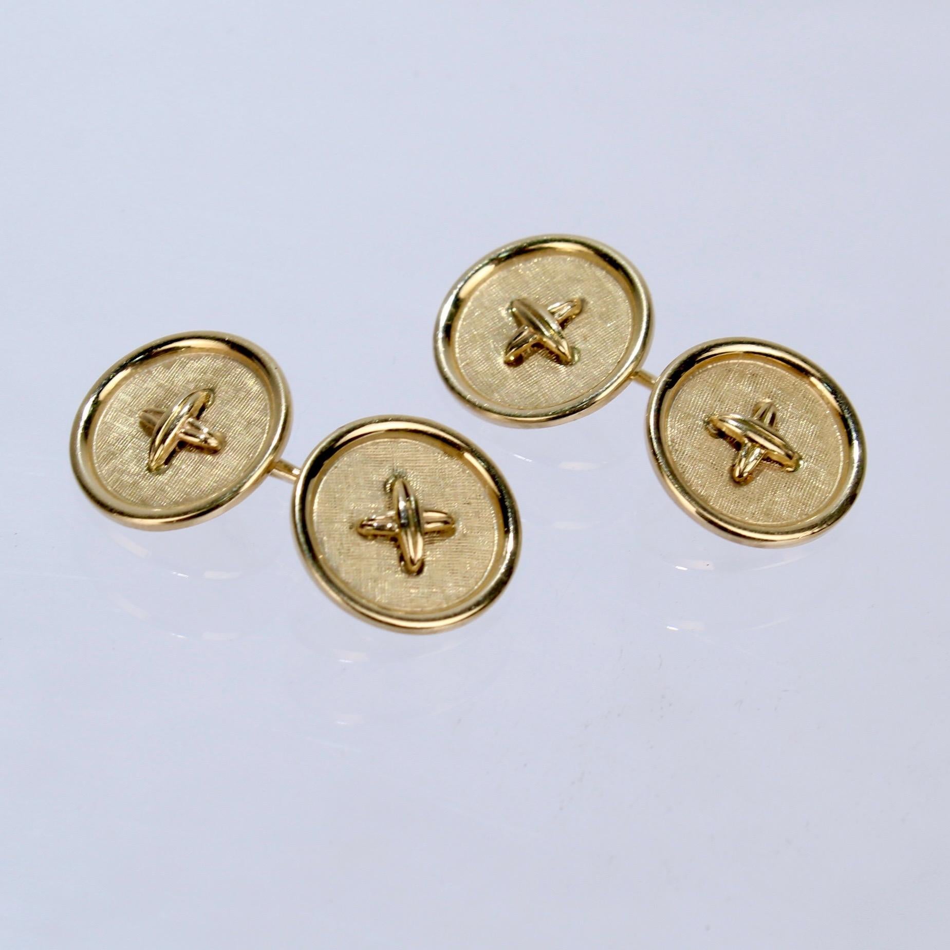 A wonderful pair of gold cufflinks in the shape of buttons.

A classic form that is a great addition to any cufflink collection!

Marked on the link 14K and with a model no. L2-778.

Length: ca. 20mm
Button Diameter: ca. 15 mm

Items purchased from