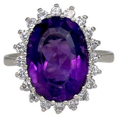 Vintage 14 Karat Gold Oval Cut Amethyst 0.60 Carat Diamond Cluster Ring