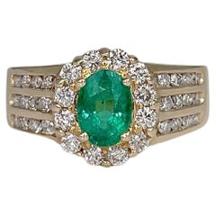 Retro 14 Karat Gold 0.90 Carat Oval Emerald 0.85 Carat Diamond Cluster Ring