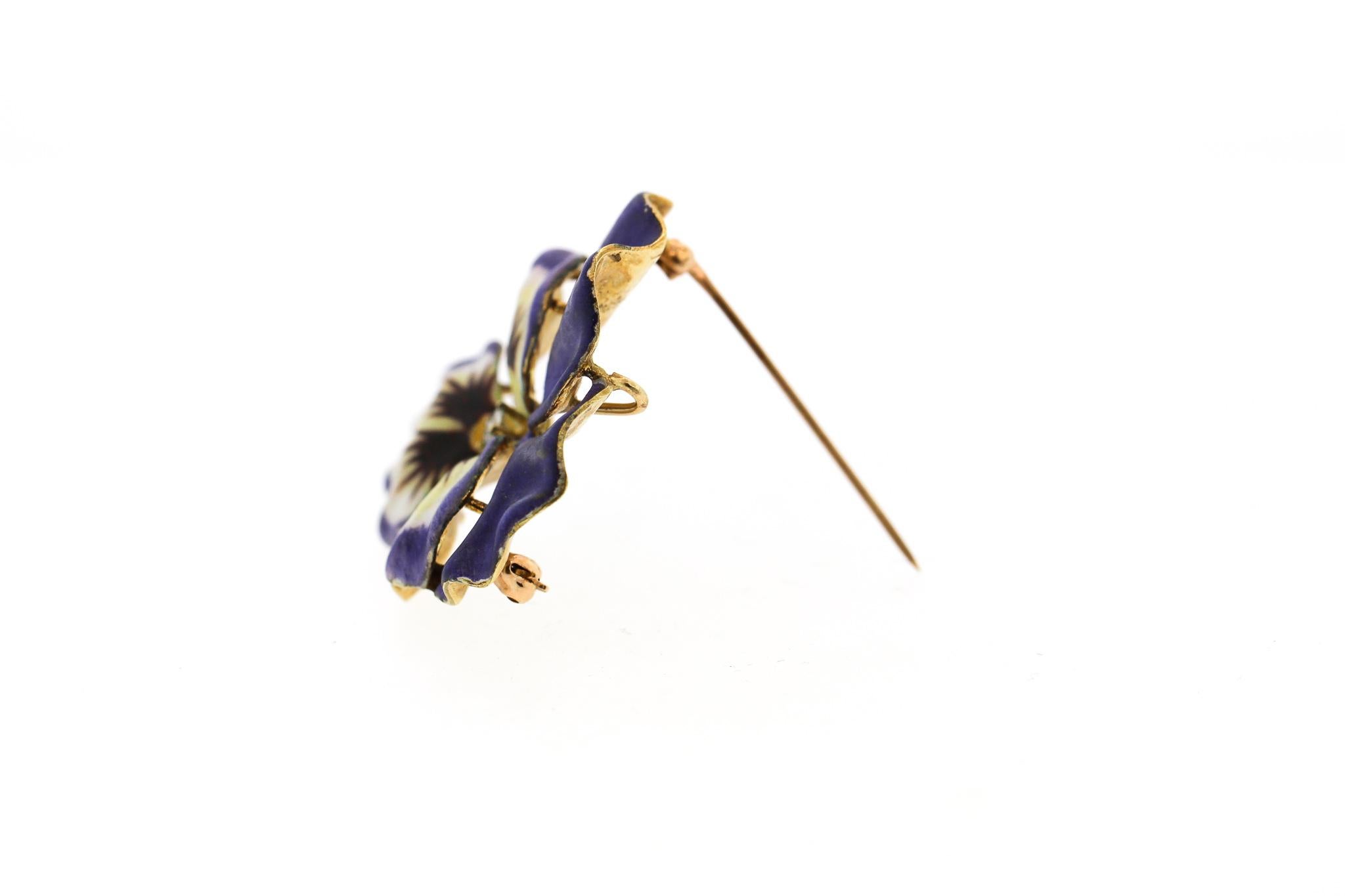 An antique vintage purple enamel pansy brooch made in 14k yellow gold and set with a diamond. The pin likely dates to about 1940. These types of pins were made as early as 1900 in the Art Nouveau era. Many were made in Newark, NJ by goldsmiths using
