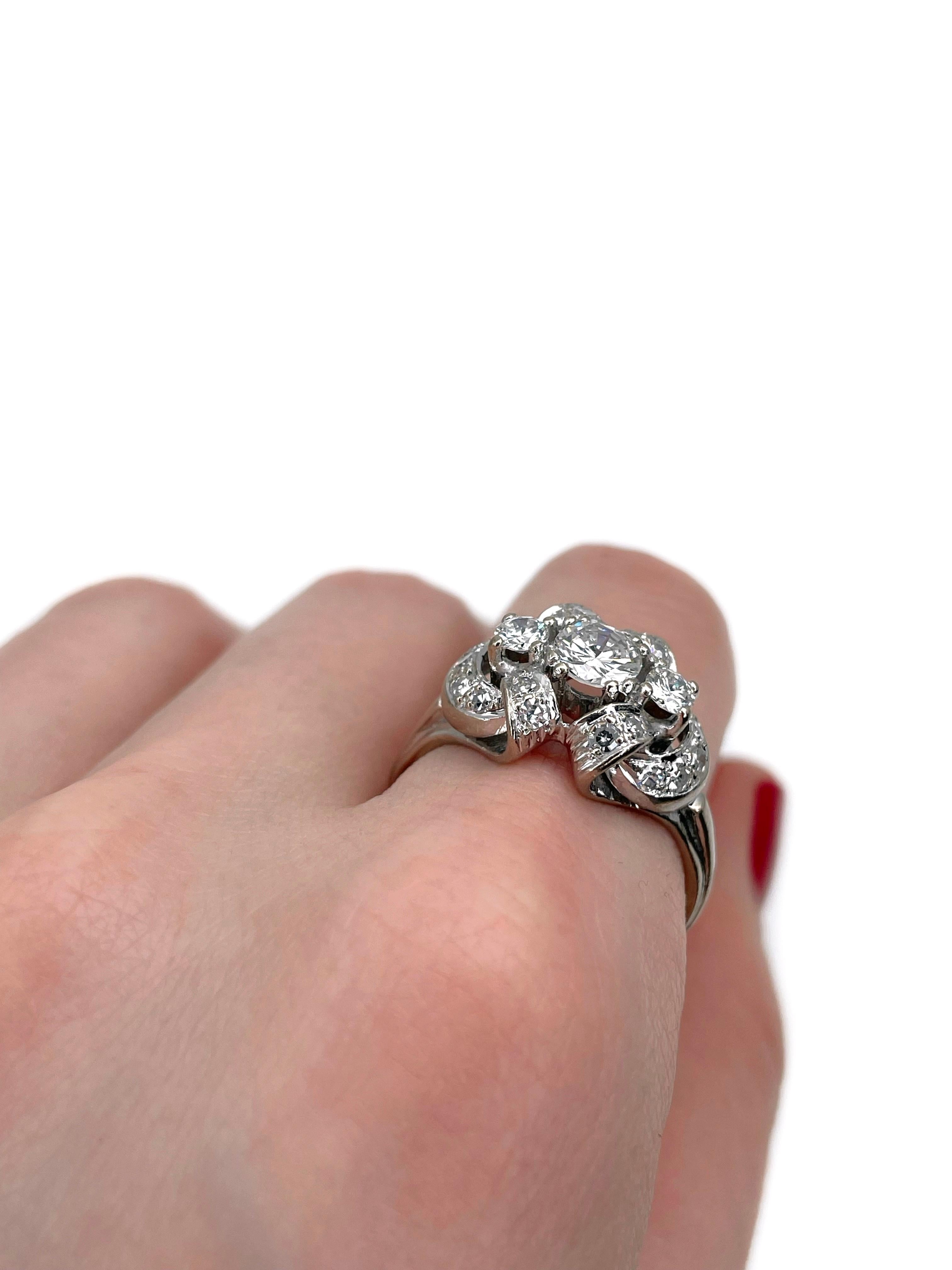 This is a vintage cocktail ring crafted in 14K white gold. Circa 1980. 

The piece features diamonds (TW 1.10ct):
- 3 diamonds (round brilliant cut, TW 0.80ct, RW-W, VS)
- 18 diamonds (RBC-17, 0.30ct, RW-W, VS-SI)

Weight: 6.68g
Size: 19 (US