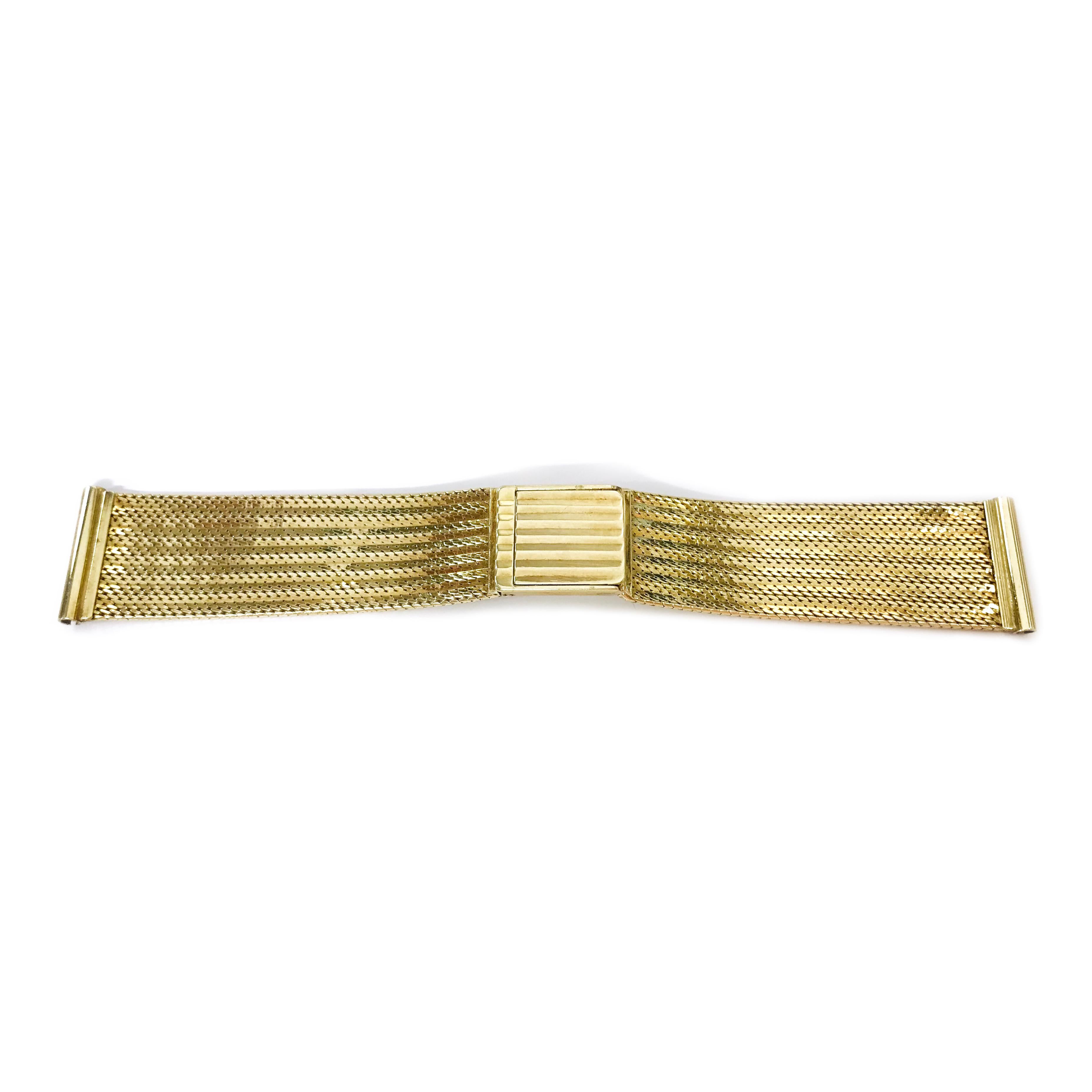 Vintage 14 Karat Gold Mesh Watch Band, Circa 1970s. Stamped on the inside clasp is 14K 50 AR meaning the band was manufactured in the Arezzo area of Italy. The gold band is 4.85