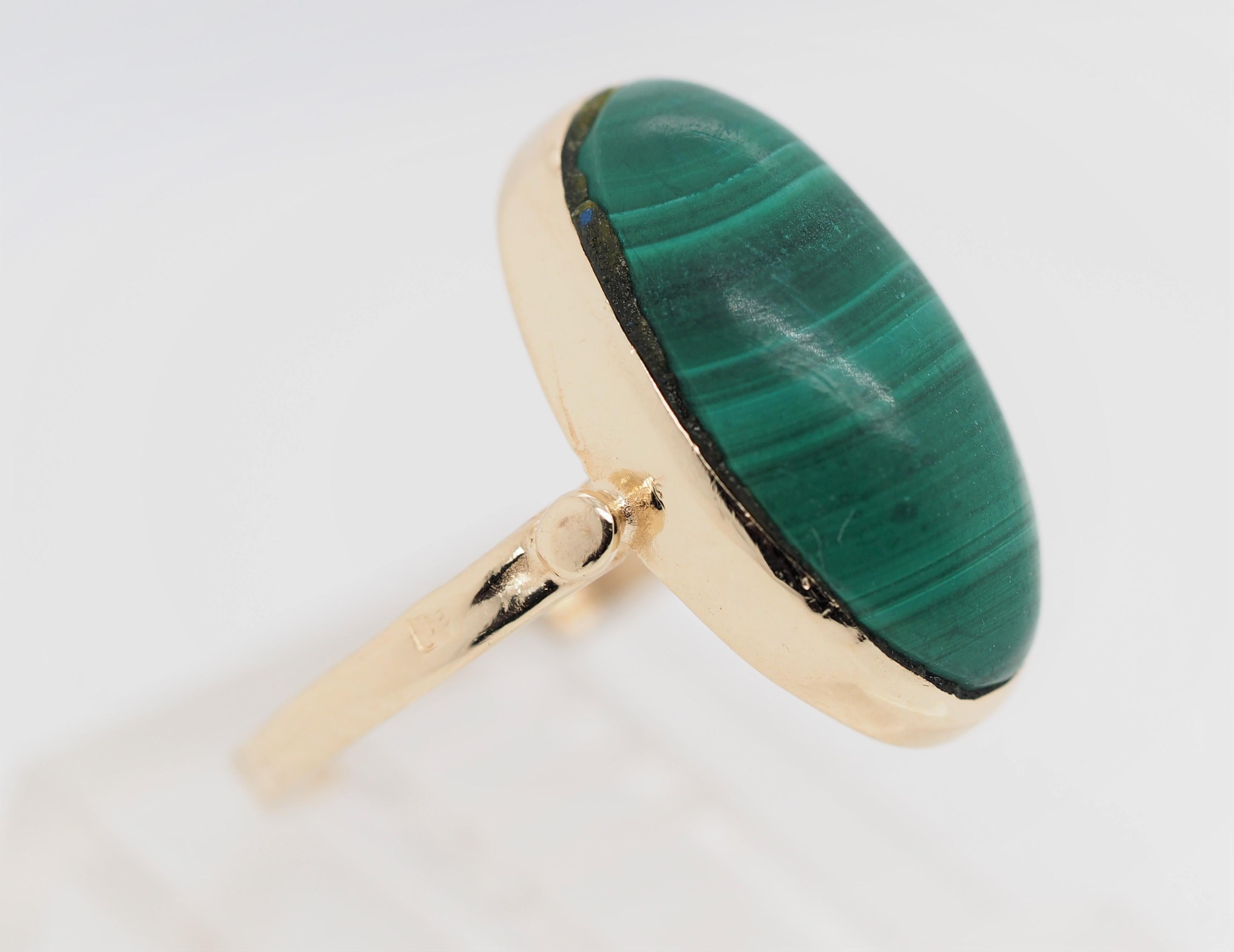 This Vintage beauty is a perfect example of the 1960's style rings. The Marquise Cut Malachite is an eye catcher. 

Item Details: 
Ring Size: 3.25
Metal Type: 14K Yellow Gold 
Weight: 2.6 grams
Hallmark: None
Engraving: None
Width: 15.7  mm at head