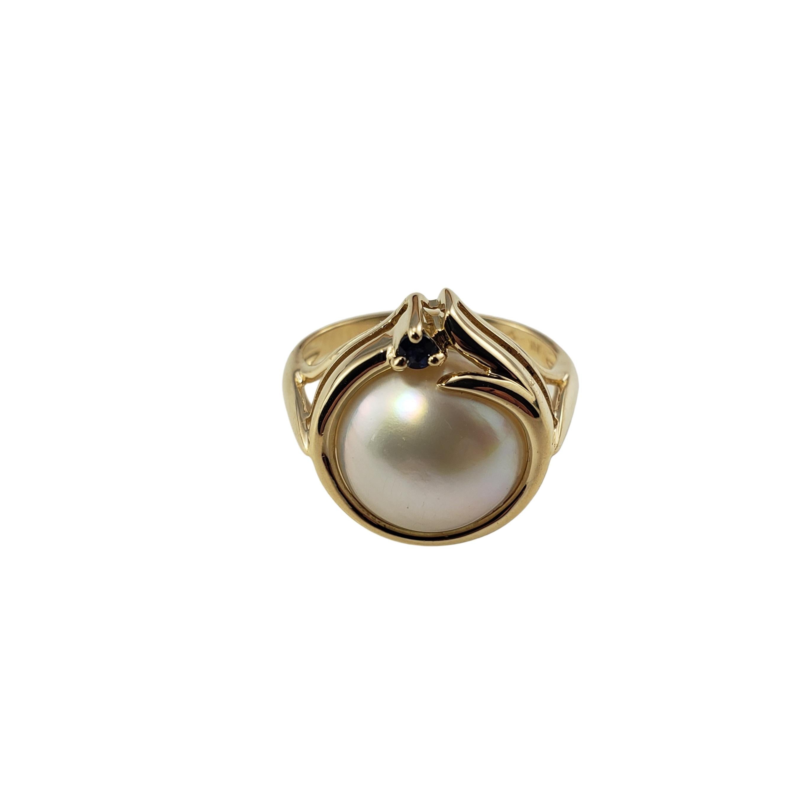 Vintage 14 Karat Yellow Gold Mabe Pearl and Sapphire Ring Size 7-

This lovely ring features one Mabe pearl (11 mm) and one round sapphire set in classic 14K yellow gold.

Shank: 2 mm

Size:  7

Weight:  3.0 dwt. /  4.7 gr.

Stamped:  14K

Very good