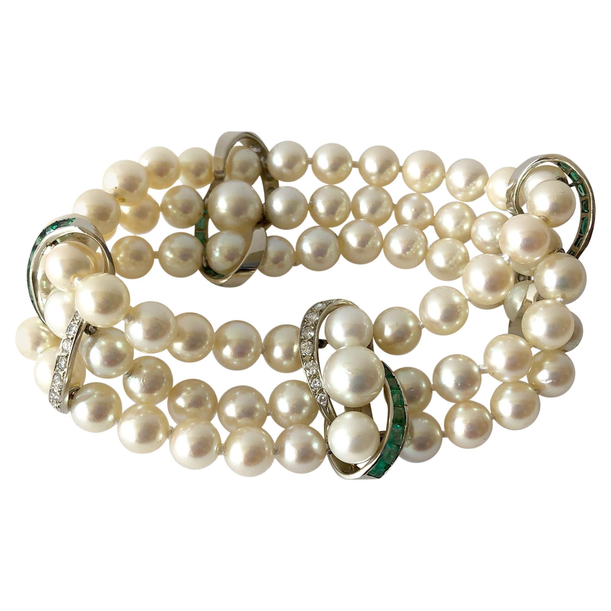 Dreireihiges Vintage-Armband aus 14 Karat Weißgold 1960er Jahre mit Diamanten, Smaragden und Perlen