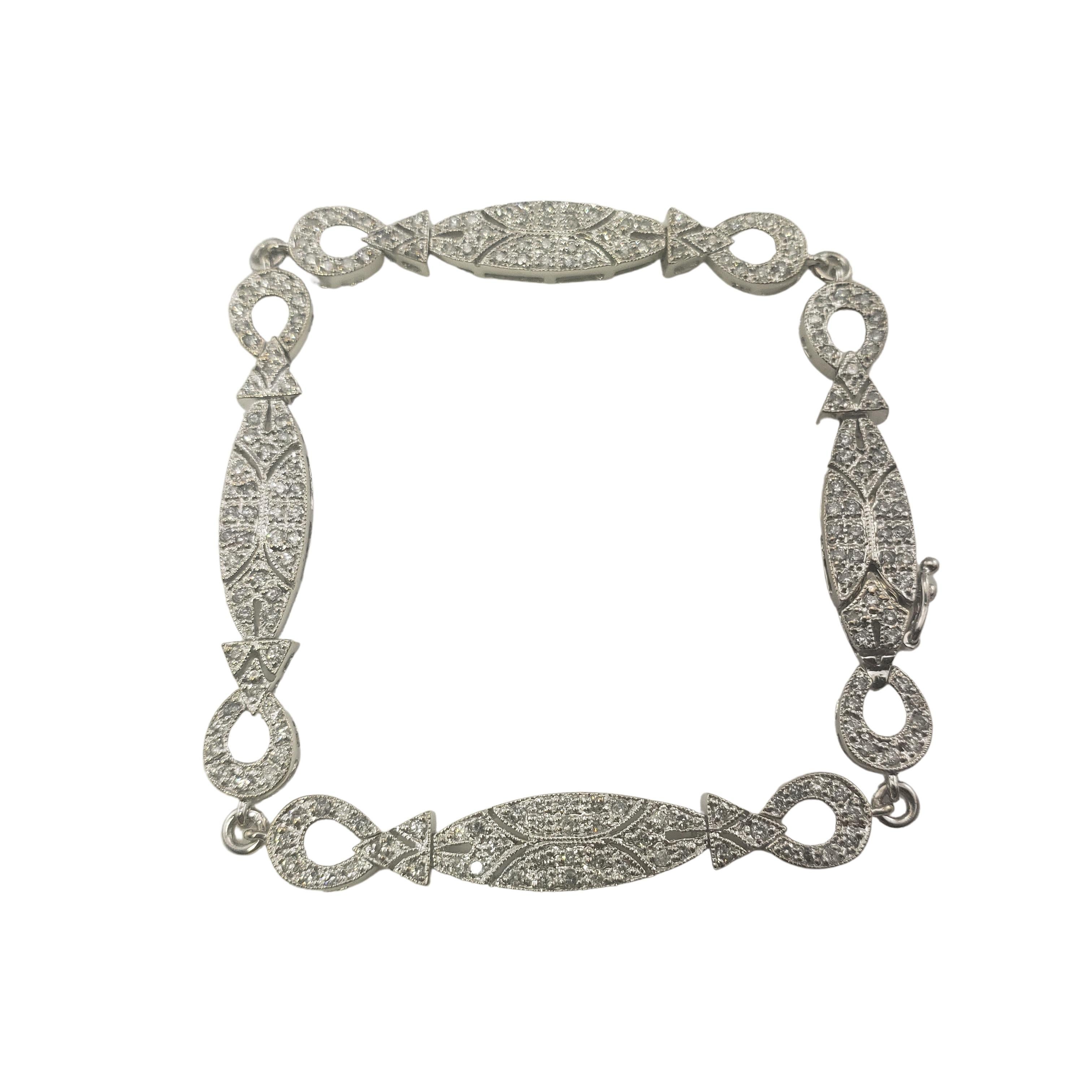 Vintage 14 Karat White Gold and Diamond Bracelet-

This sparkling bracelet features 197 round brilliant cut diamonds set in classic 14K white gold.  Width:  6 mm.

Approximate total diamond weight:  1 ct.

Diamond color:  H-I

Diamond clarity: