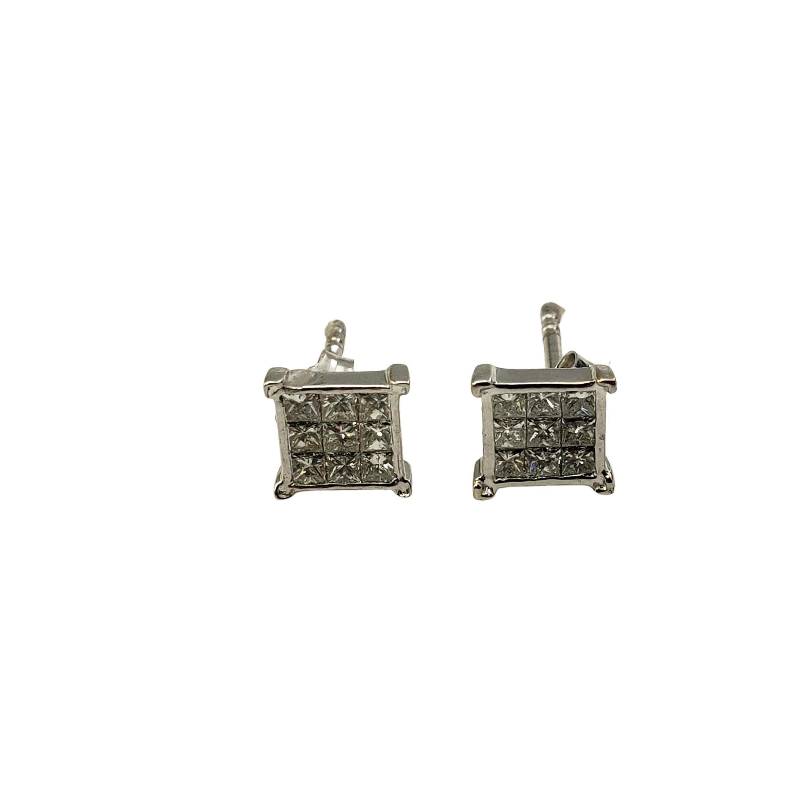 Vintage 14 Karat White Gold and Diamond Earrings-

These sparkling earrings each feature 18 princess cut diamonds set in classic 14K white gold.  Push back closures.

Approximate total diamond weight:  .54 ct.

Diamond color:  K

Diamond clarity: 