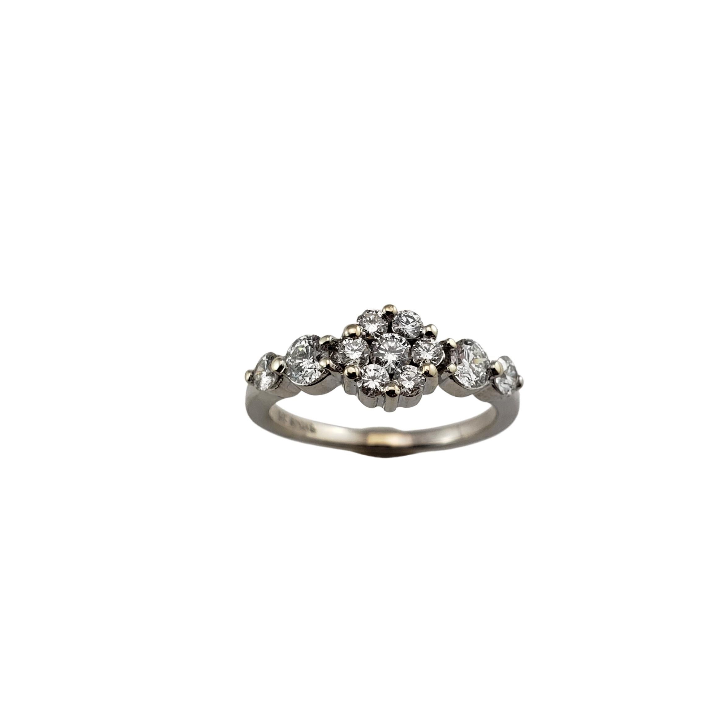 Vintage 14 Karat White Gold and Diamond Ring Size 6.25-

This sparkling flower ring features 11 round brilliant cut diamonds set in beautifully detailed 14K white gold. Shank: 2 mm.

Approximate total diamond weight: .63 ct.

Diamond color: