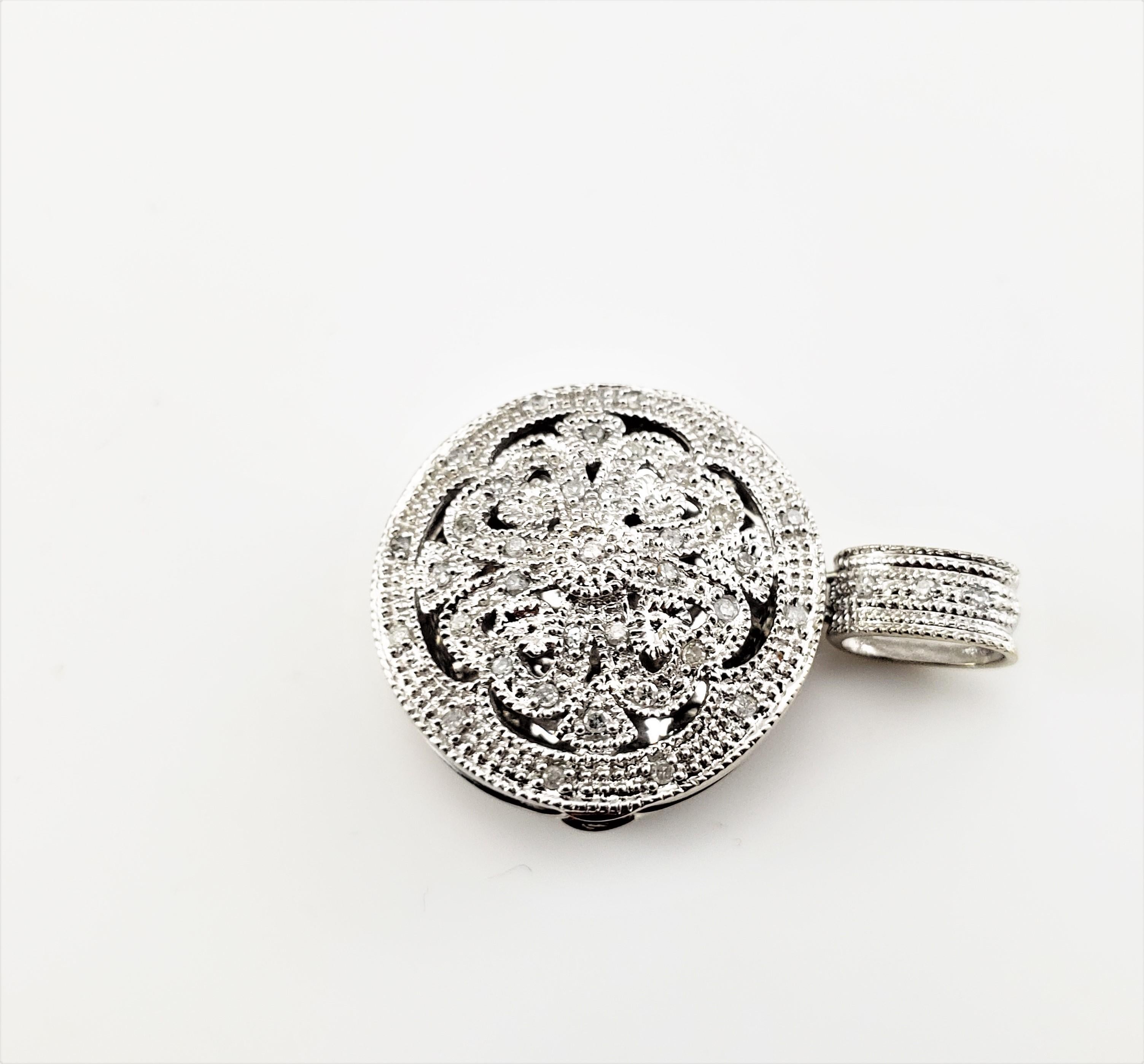 Vintage 14 Karat White Gold and Diamond Locket Pendant-

This lovely 14K white gold pendant features 40 round single cut diamonds set in a stunning floral design.

Approximate total diamond weight: .20 ct.

Diamond color: I

Diamond clarity: