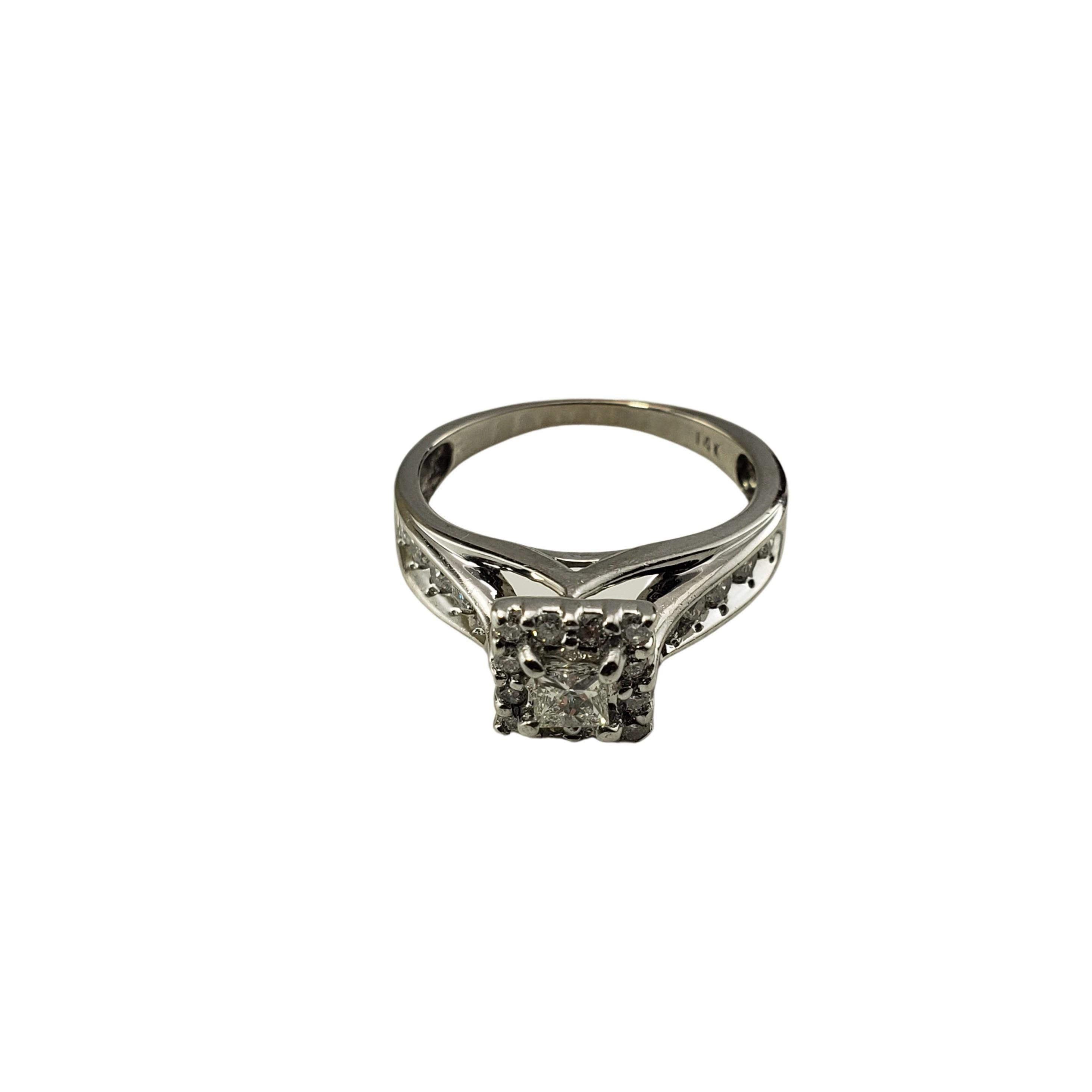 Vintage 14 Karat White Gold and Diamond Ring Size 6-

This sparkling ring features one princess cut diamond (.15 ct.) surrounded by 22 round brilliant cut diamond set in classic 14K white gold.  Width:  7 mm.  Shank: 1.5 mm.

Approximate total
