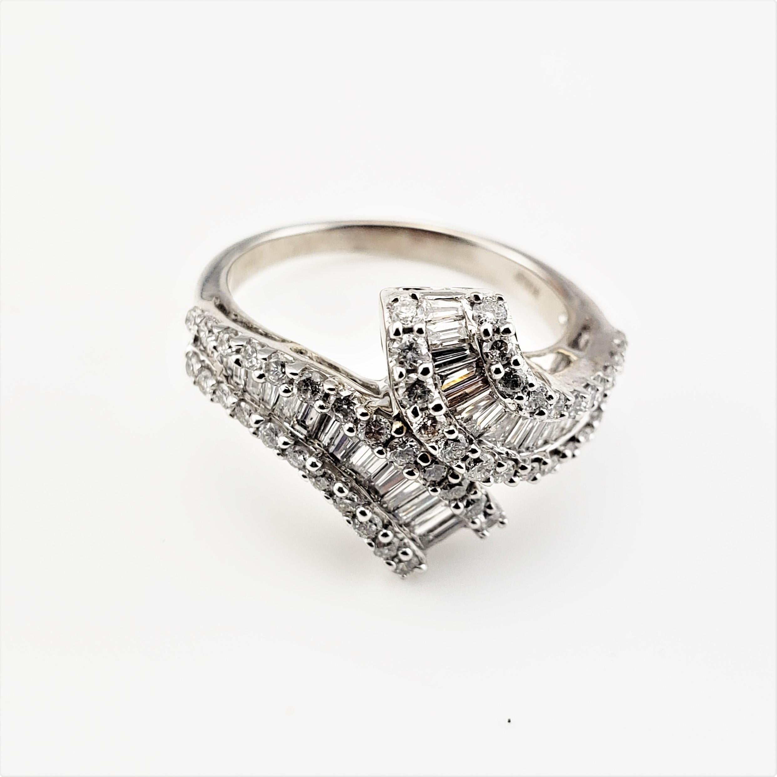 14 Karat White Gold and Diamond Ring Size 6.75 GAI Certified-

This sparkling ring features five round brilliant cut diamonds and 37 baguette diamonds set in classic 14K white gold.  Width:  15 mm.
Shank:  2 mm.

Total diamond weight:  1.25