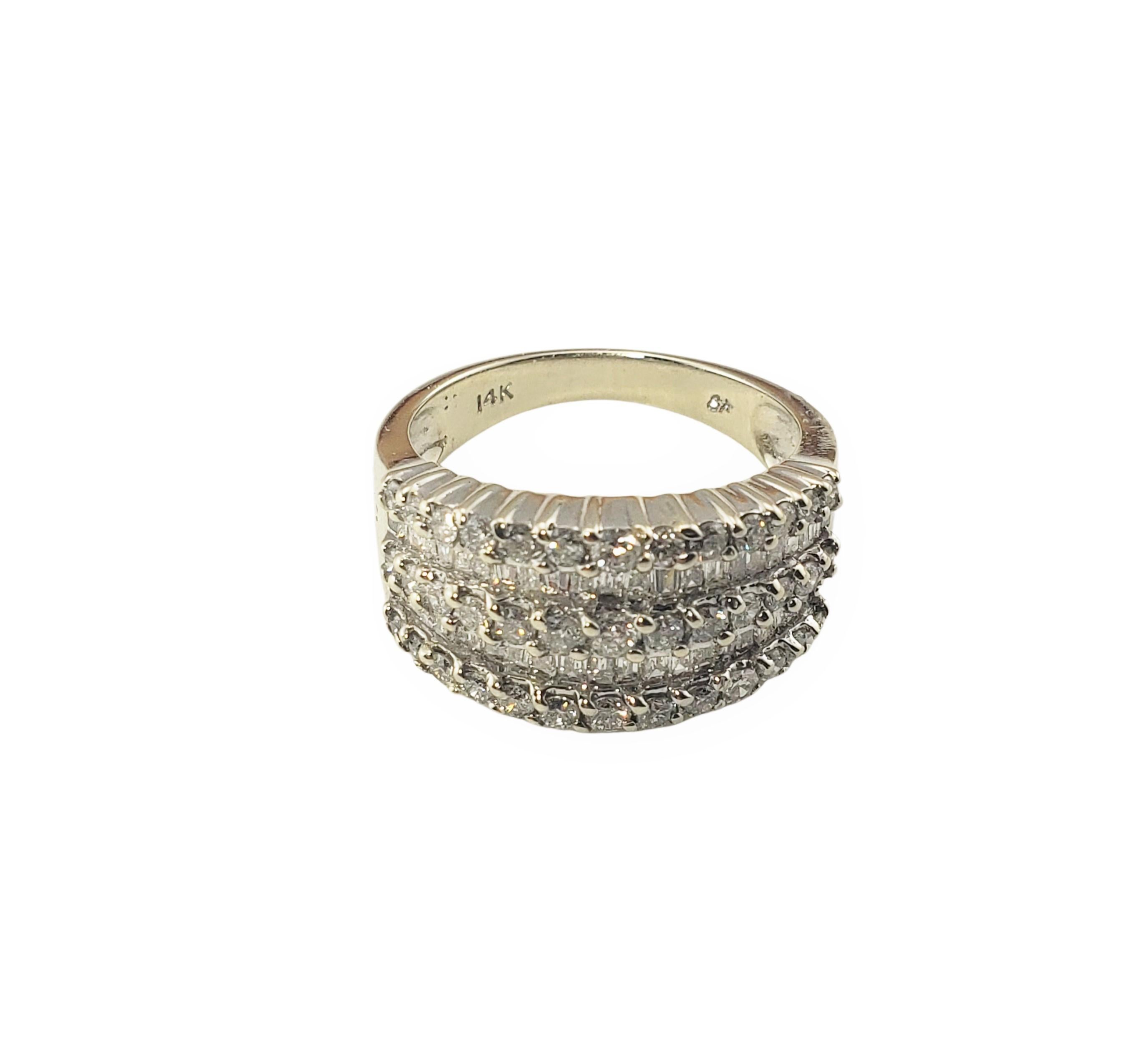 14 Karat White Gold and Diamond Ring Size 7.25-

This sparkling band features 46 baguette diamonds and 39 round brilliant cut diamonds set in classic 14K white gold.  Width: 10 mm.
Shank:  3 mm.

Approximate total diamond weight:  2 ct.

Diamond