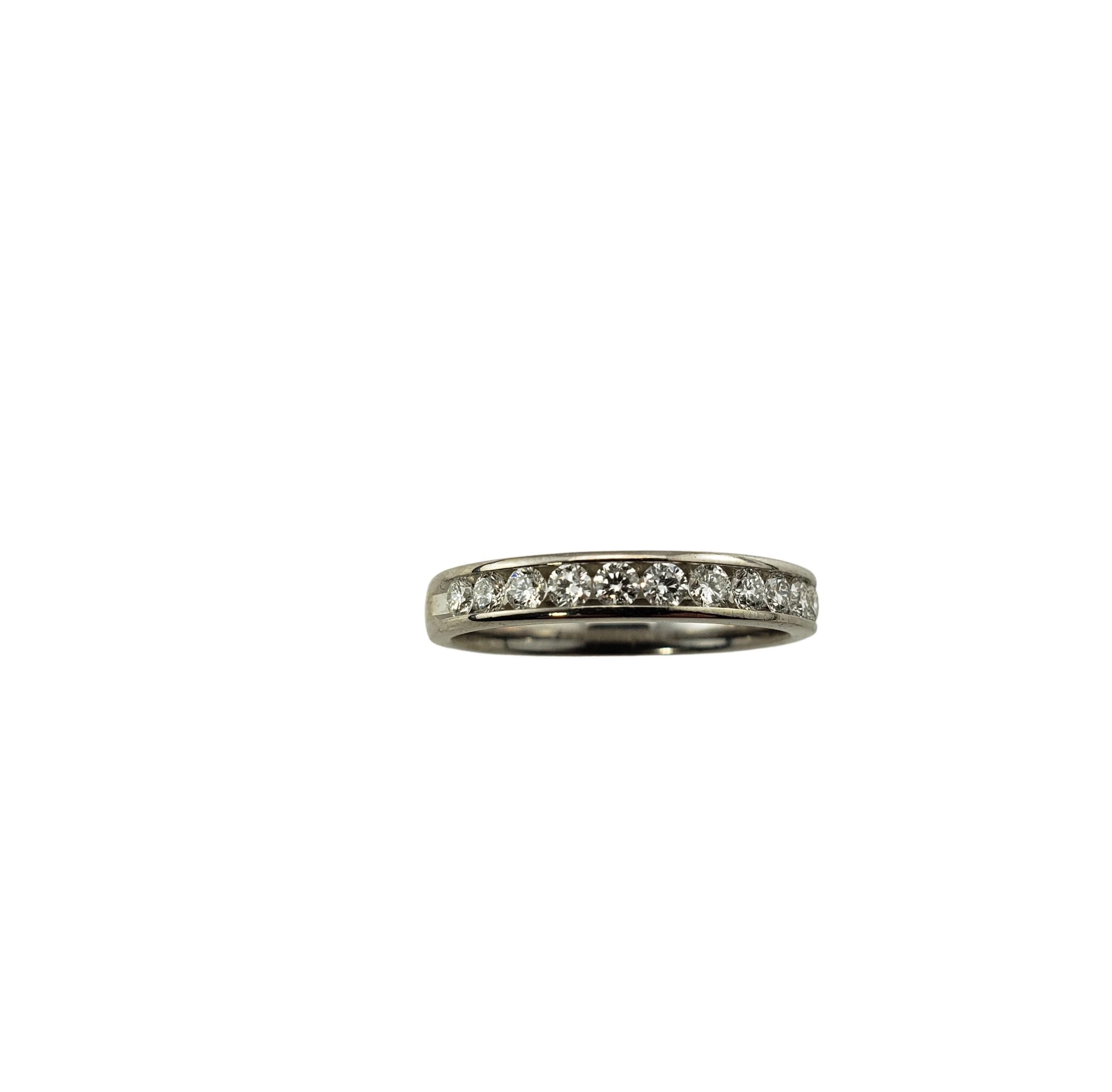 Vintage 14 Karat White Gold and Diamond Wedding Band Ring Size 5-

This sparkling band features 11 round brilliant cut diamonds set in classic 14K white gold.  Width: 3 mm.

Approximate total diamond weight:  .33 ct.

Diamond color:  G

Diamond