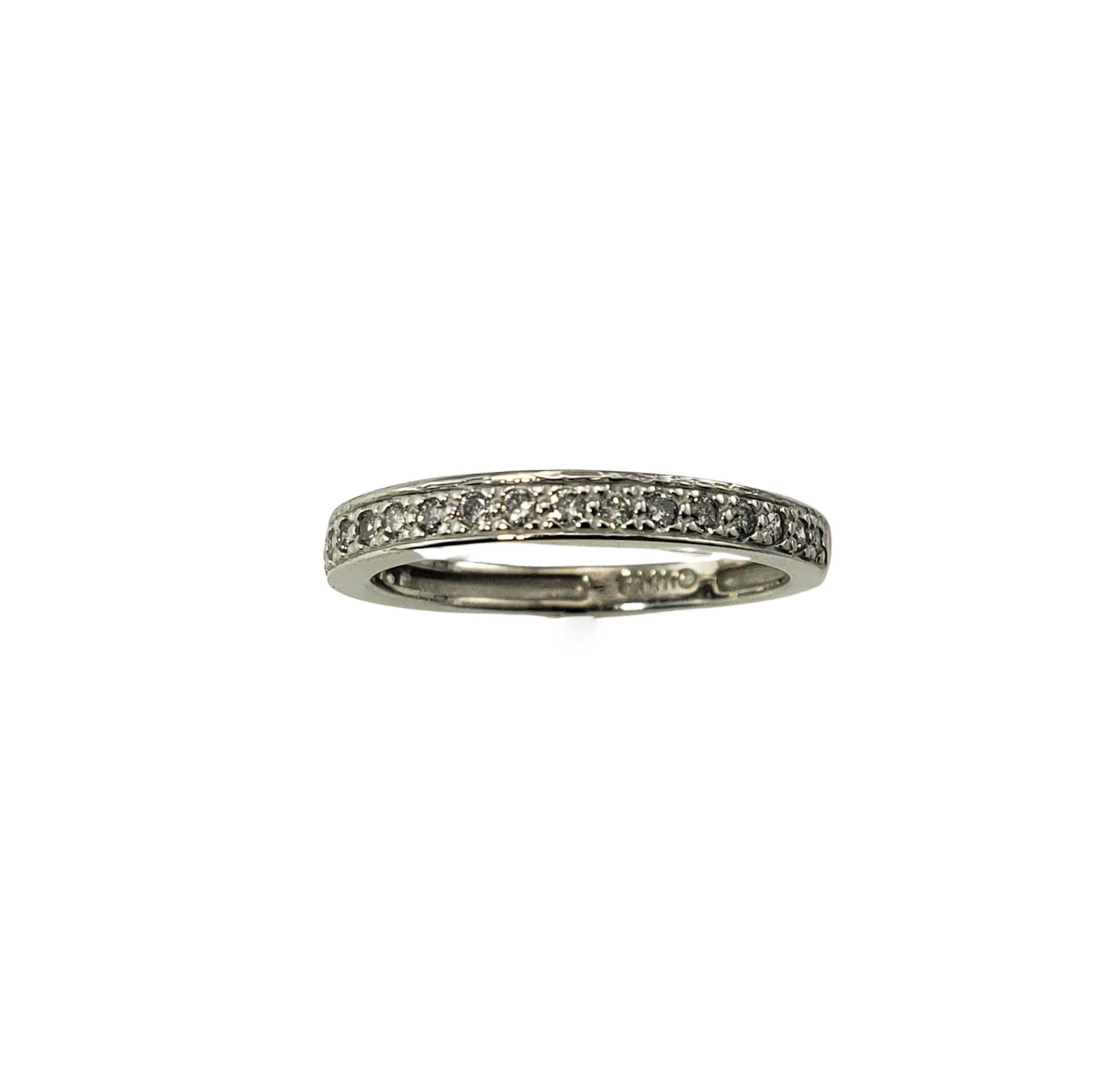 Vintage 14 Karat White Gold and Diamond Wedding Band Ring Size 5.5-

This sparkling band features 20 round brilliant cut diamonds set in classic 14K white gold.  Width:  2.5 mm.

Approximate total diamond weight:  .30 ct.

Diamond color: I

Diamond