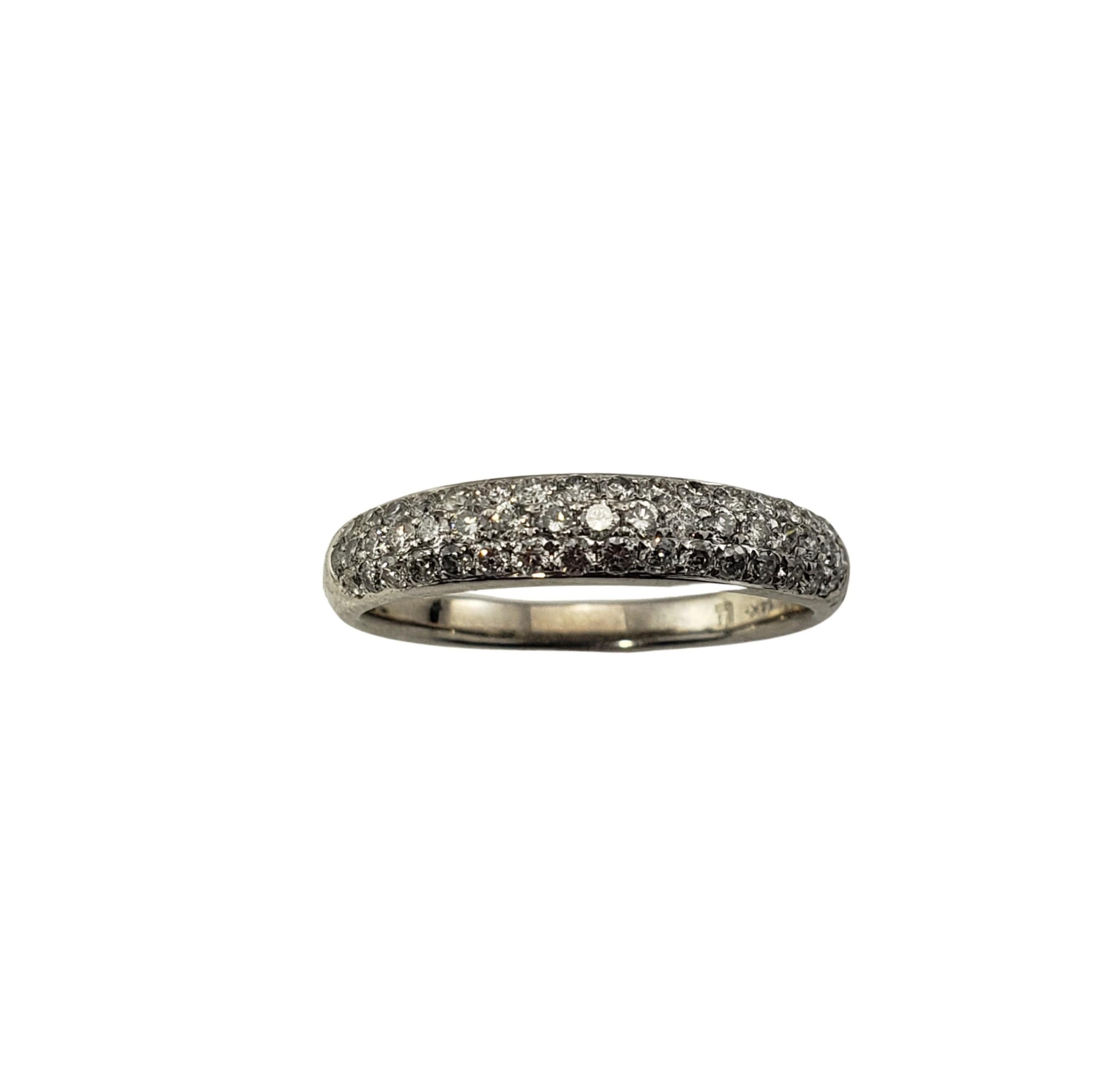 Vintage 14 Karat White Gold and Diamond Wedding Band Ring Size 6.5-

This sparkling band features 49 round brilliant cut diamonds set in beautifully detailed 14K white gold.  Width:  4 mm.  Shank: 2 mm.

Approximate total diamond weight:  .50