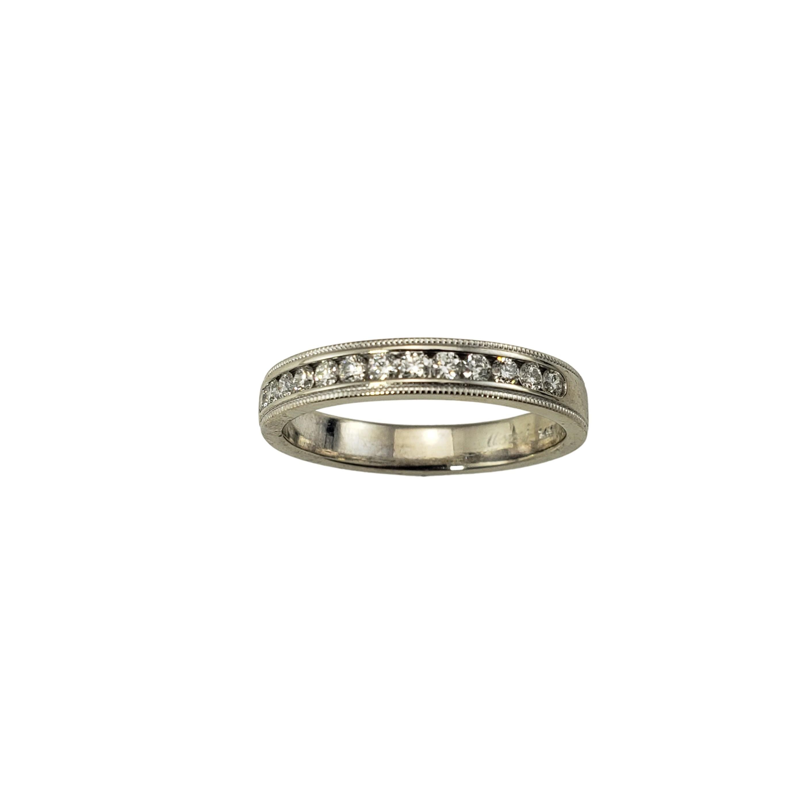 Vintage 14 Karat White Gold and Diamond Wedding Band Ring Size 7-

This sparkling band features 13 round brilliant cut diamonds set in classic 14K white gold.  Finished with an elegant milgrain edge.  Width:  3 mm.

Approximate total diamond weight: