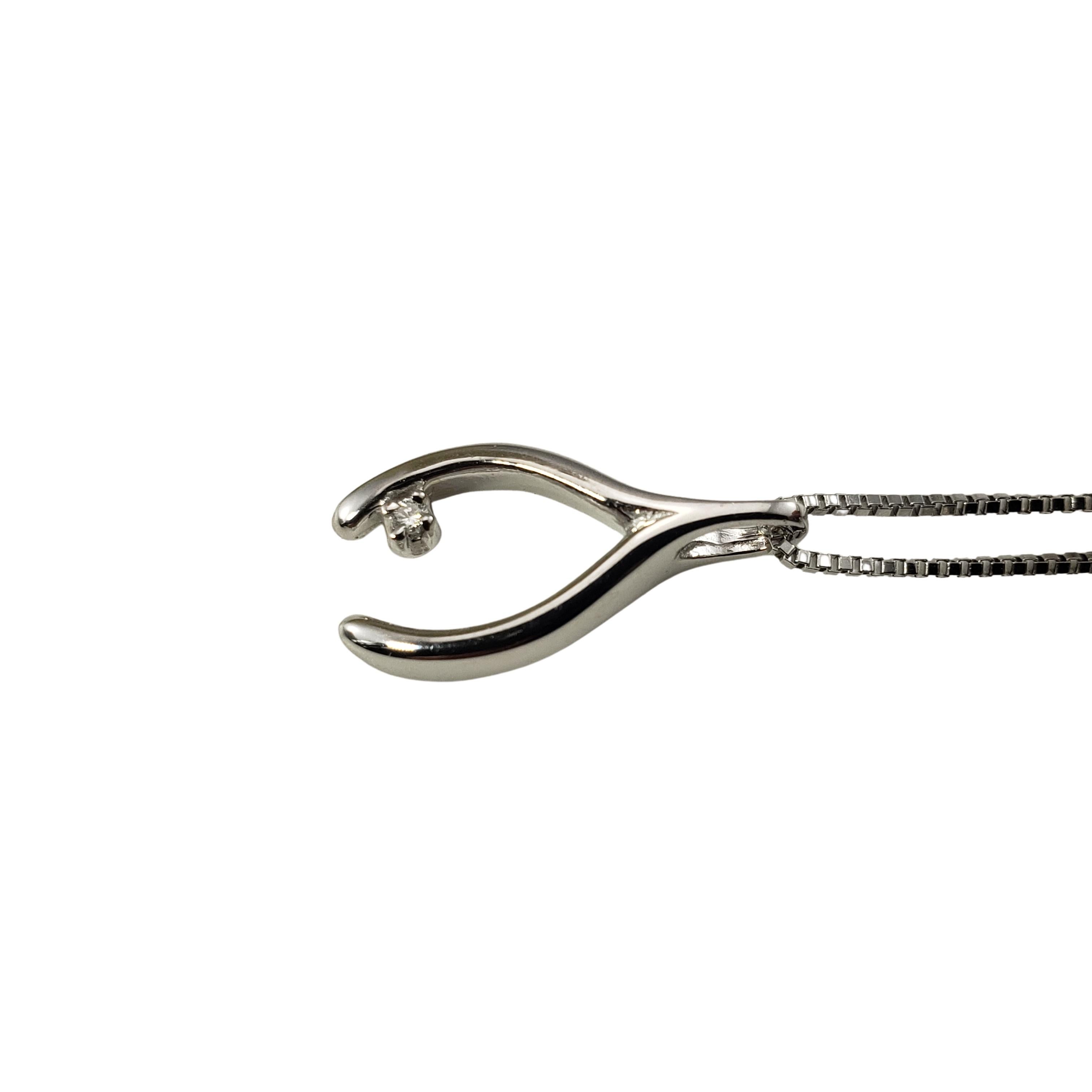Vintage 14 Karat White Gold and Diamond Wishbone Pendant Necklace-

This lucky wishbone pendant features one round brilliant cut diamond set in beautifully detailed 14K white gold.  Suspends from a classic 14K white gold necklace.

Approximate total