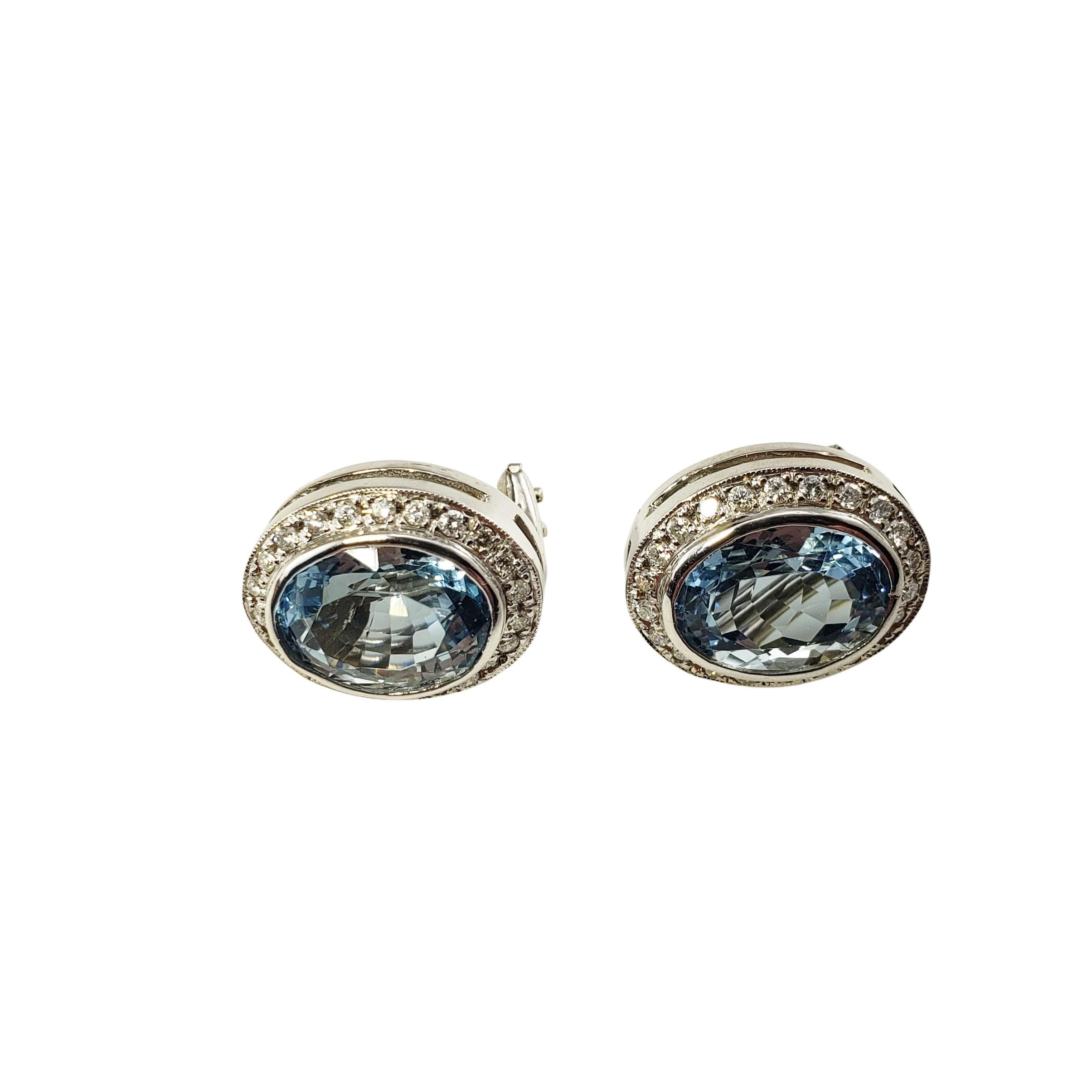 14 Karat Aquamarine and Diamond Earring GAI Certified-

These stunning earrings each feature one oval aquamarine surrounded by 22 round brilliant cut diamonds.  Hinged closures.

Total Aquamarine Carat Weight:  16.00

Clarity Grade:  AAA

Total