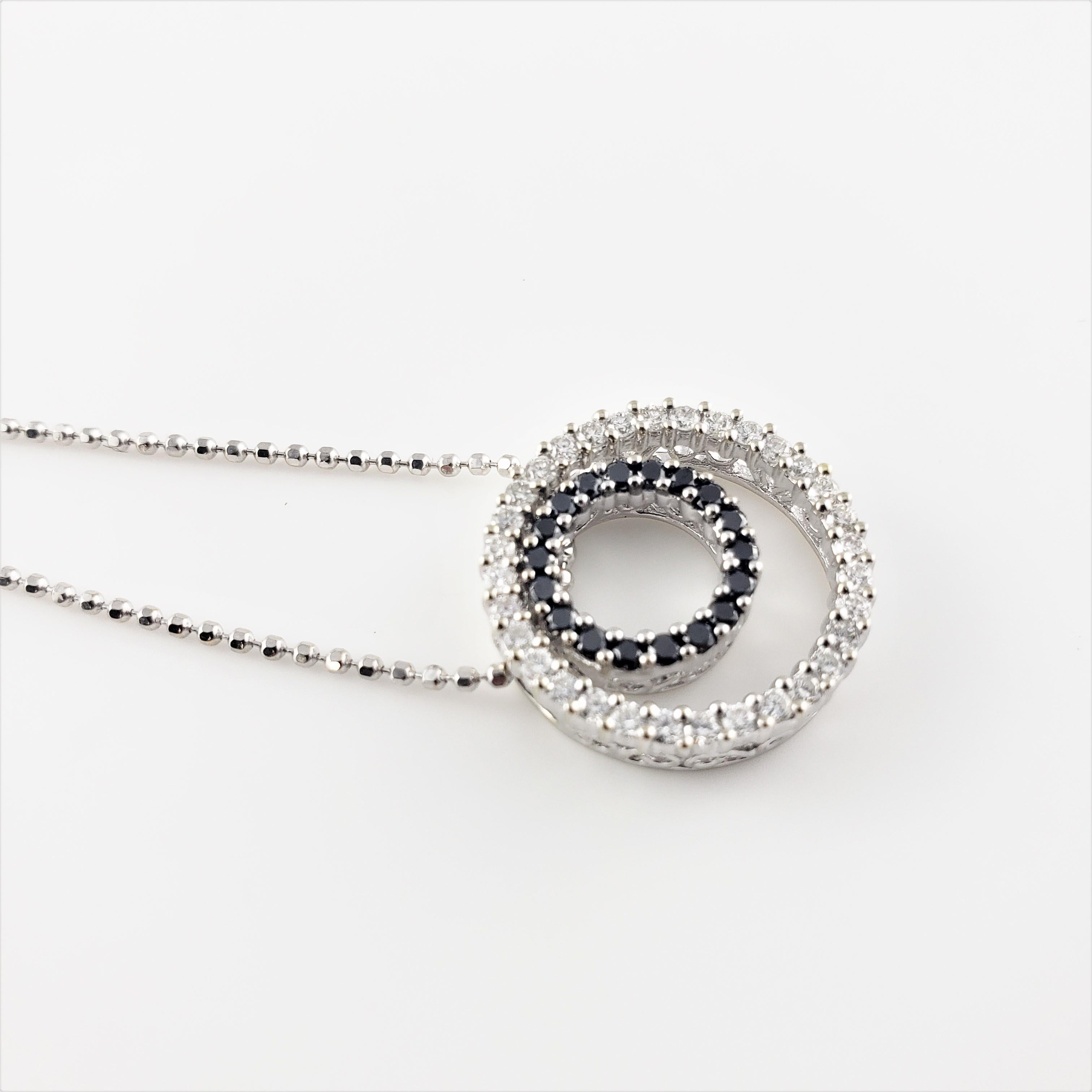 Women's 14 Karat White Gold Black and White Diamond Circle Necklace For Sale