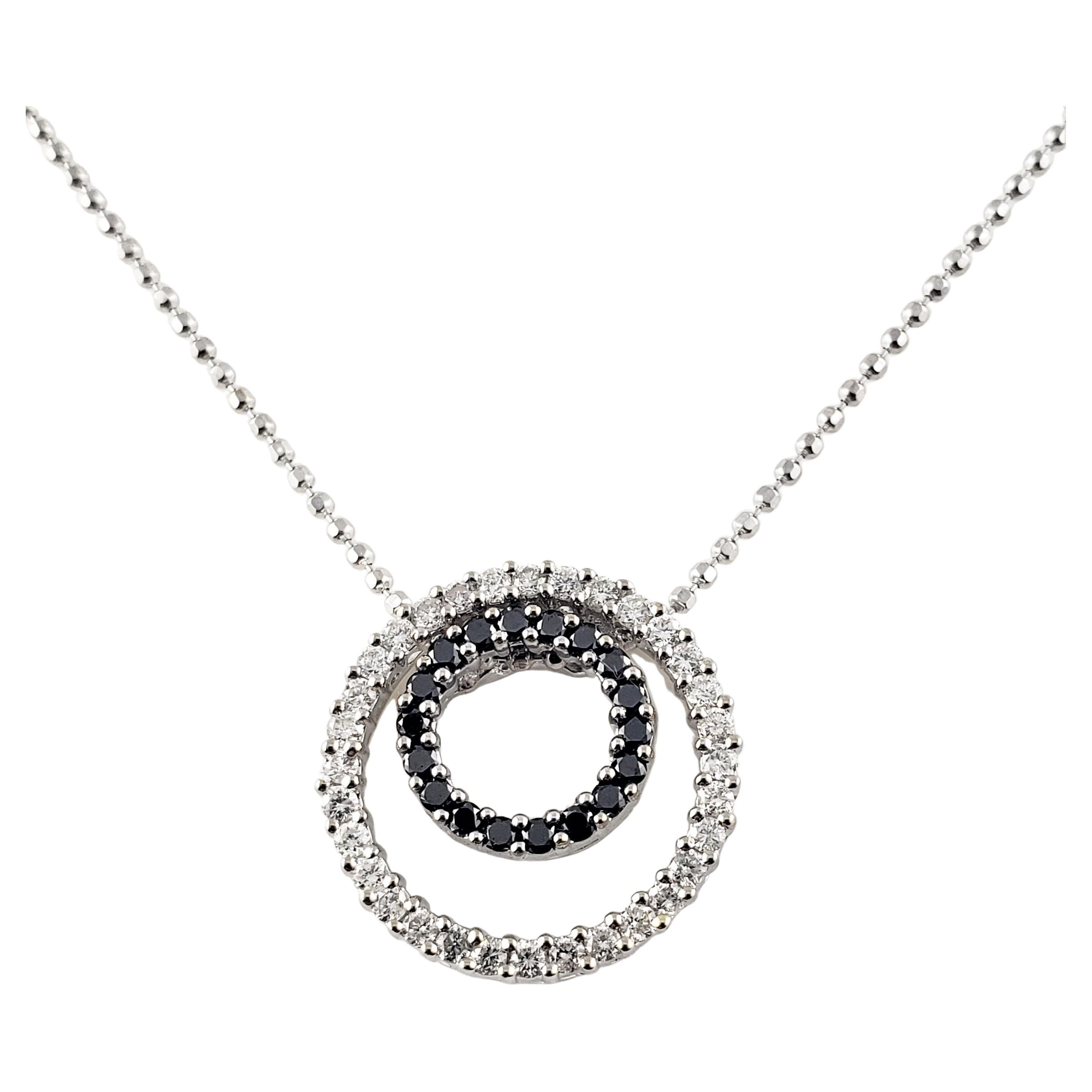 14 Karat White Gold Black and White Diamond Circle Necklace For Sale