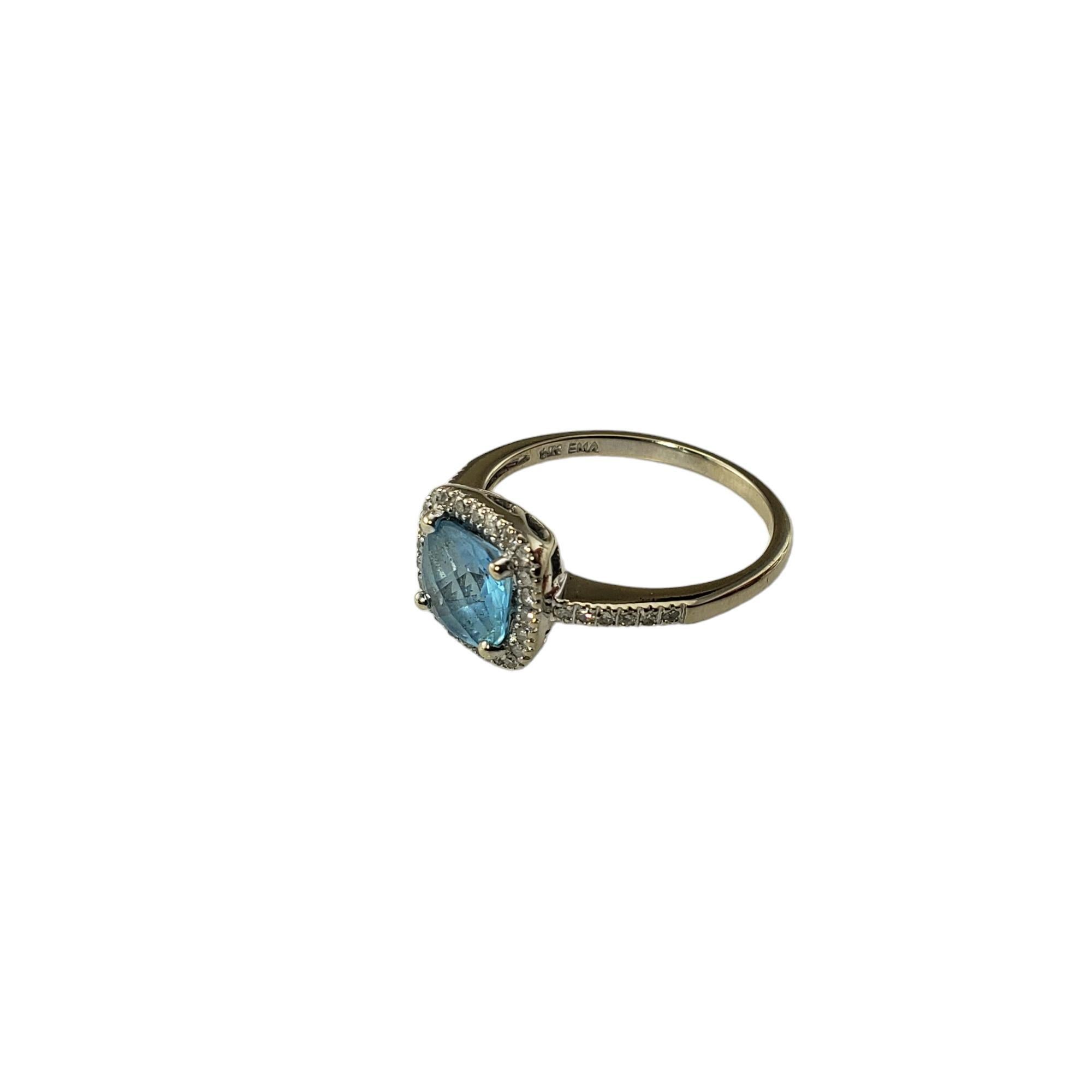 Vintage 14 Karat White Gold Blue Topaz and Diamond Ring size 7.25-

This stunning ring features one blue topaz stone (7 mm x 7 mm) surrounded by 36 round single cut diamonds set in classic 14K white gold.  Width:  9.8 mm.  Shank: 1.6