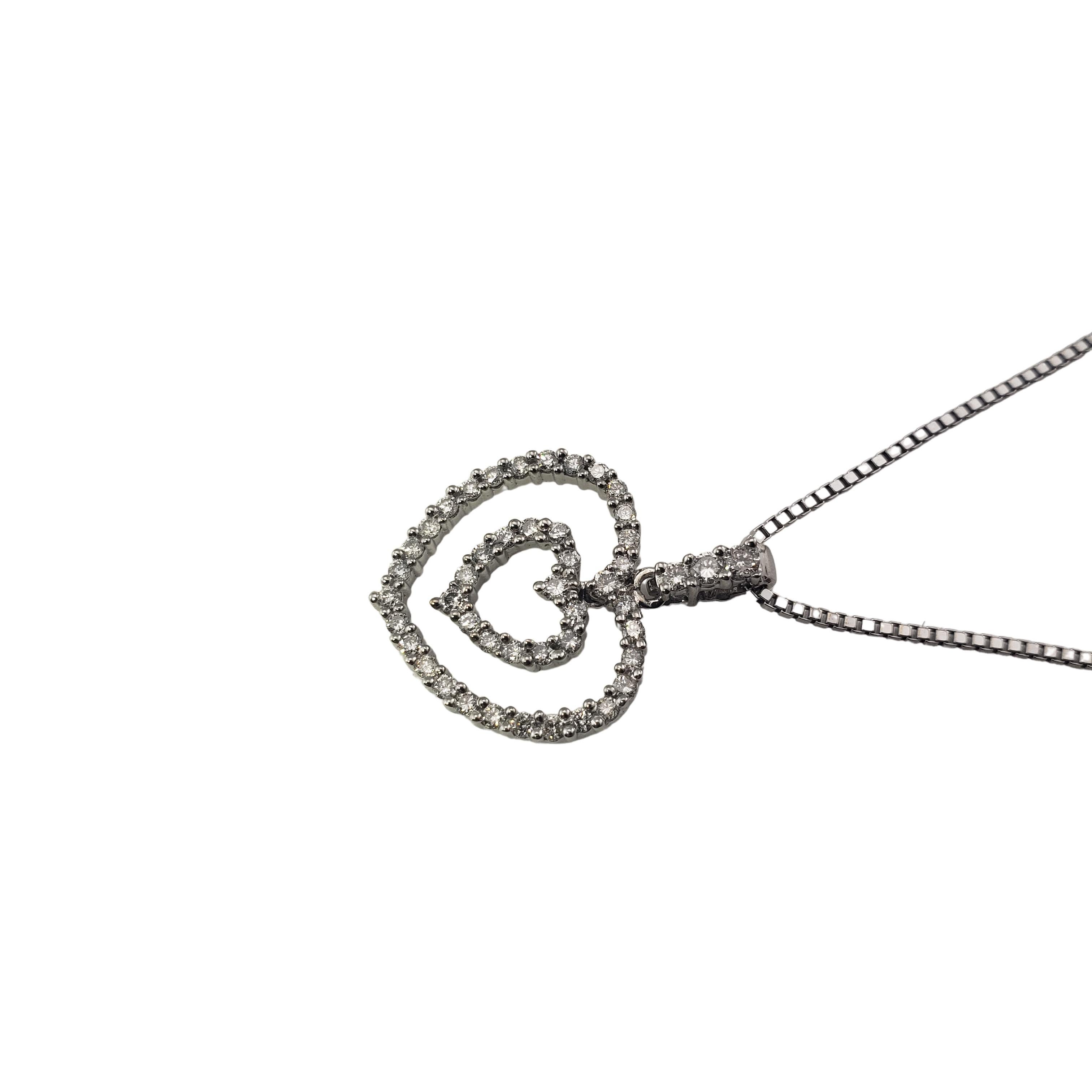 Vintage 14 Karat White Gold Diamond Double Heart Pendant Necklace-

This lovely necklace features a sparkling double heart pendant with 47 round brilliant cut diamonds set in classic 14K white gold.

Approximate total diamond weight: .50ct.

Diamond