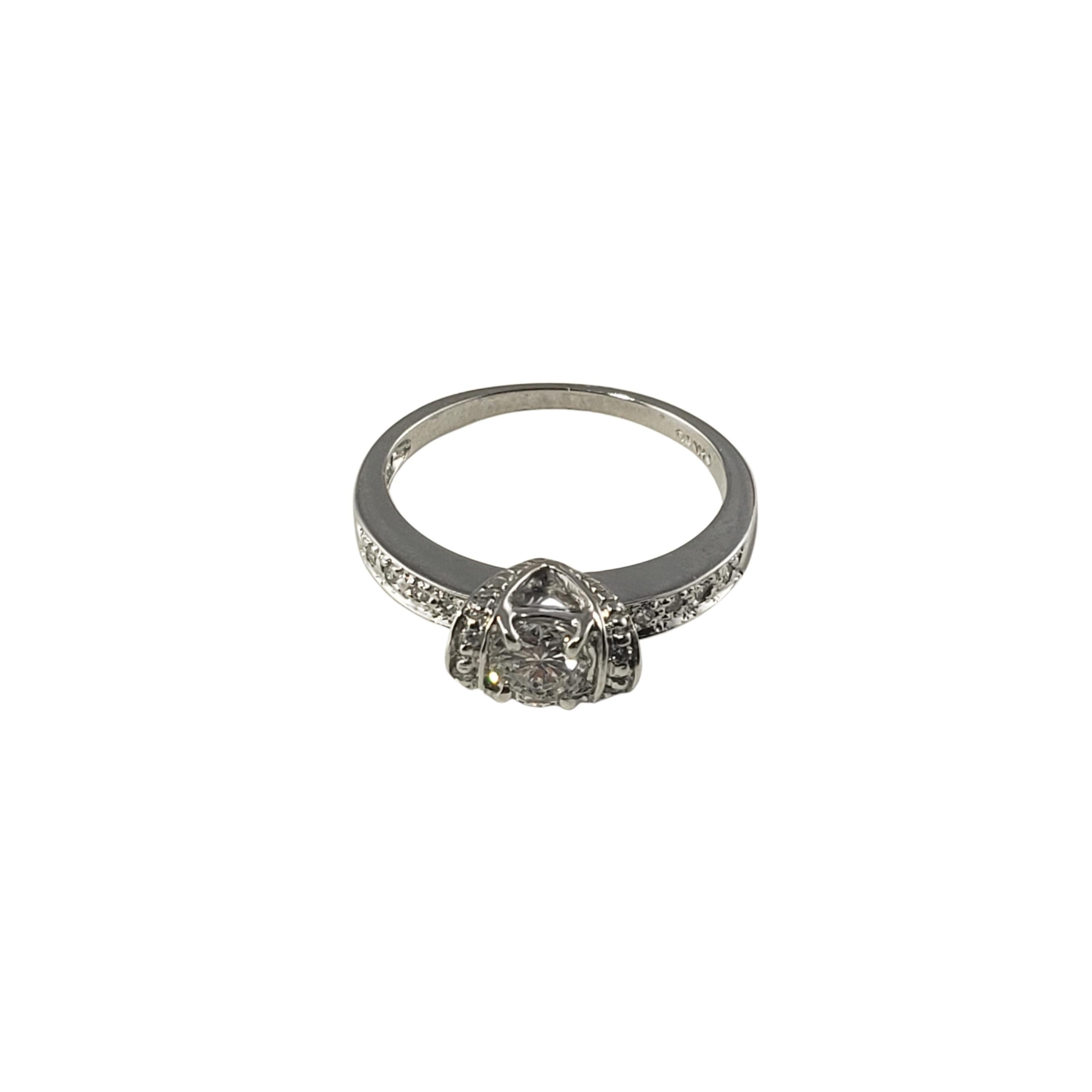 Vintage 14 Karat White Gold Diamond Engagement Ring Size 6-

This sparkling ring features 13 round brilliant cut diamonds (center stone:  .45 ct.) set in beautifully detailed 14K white gold.  
Shank:  1.5 mm.

Approximate total diamond weight: .51