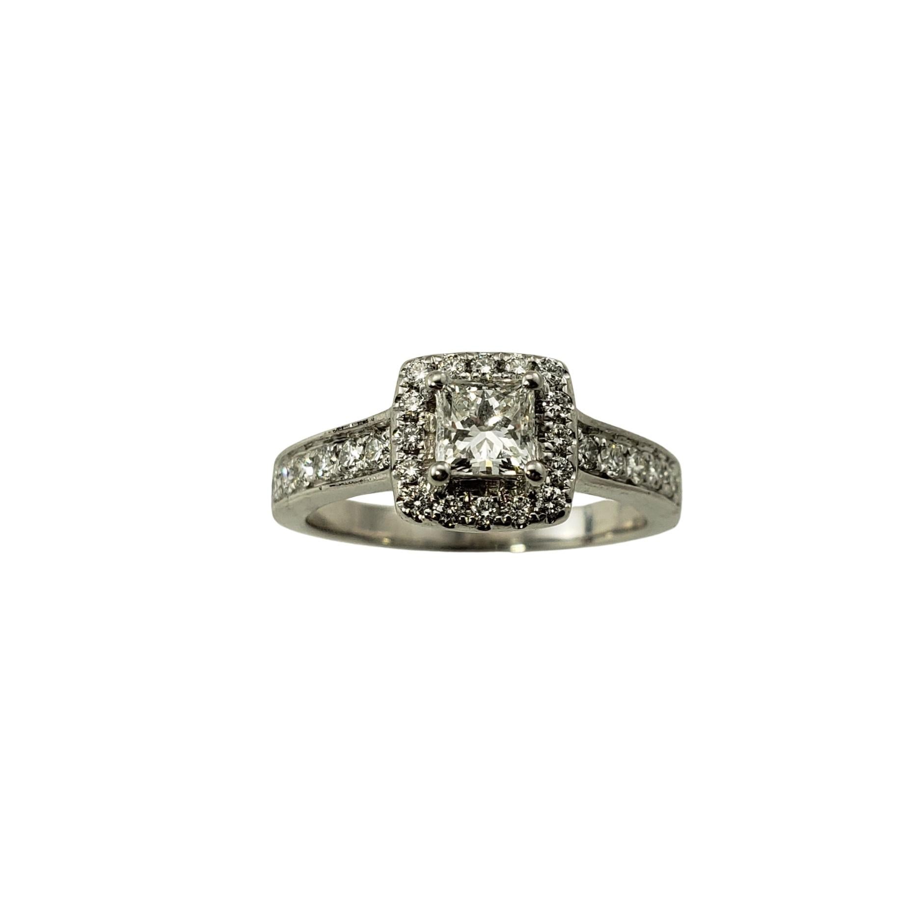 14 Karat White Gold Diamond Engagement Ring Size 7.75-

This sparkling ring features  a center princess cut diamond (.40 ct.) surrounded by 28 round brilliant cut diamonds on the halo and band.  Shank:  2.5 mm

Approximate total diamond weight:  .80