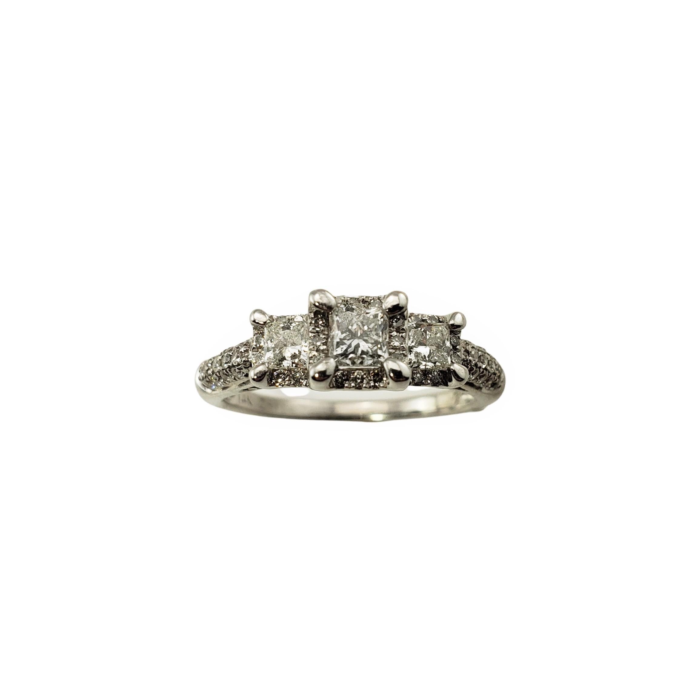 14 Karat White Gold Diamond Engagement Ring Size 8.75-

This sparkling ring features three princess cut diamonds (center: .25 ct.) and 49 round brilliant cut diamonds on the band set in beautifully detailed 14K white gold.  Shank:  1.5