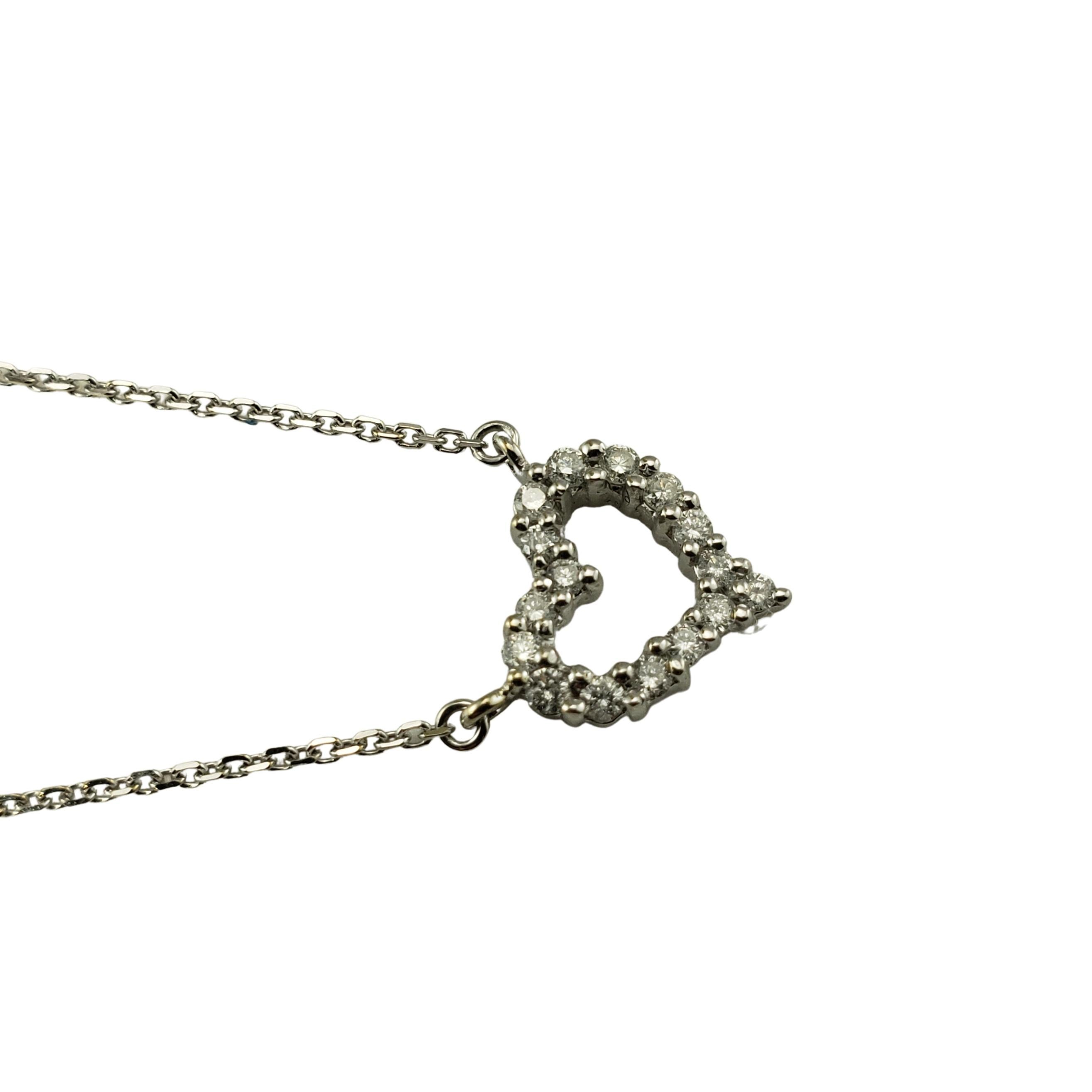 Vintage 14 Karat White Gold Diamond Heart Necklace-

This sparkling diamond heart necklace features 16 round brilliant cut diamonds set in classic 14K white gold.

Approximate total diamond weight: .24 ct.

Diamond color: I

Diamond clarity: