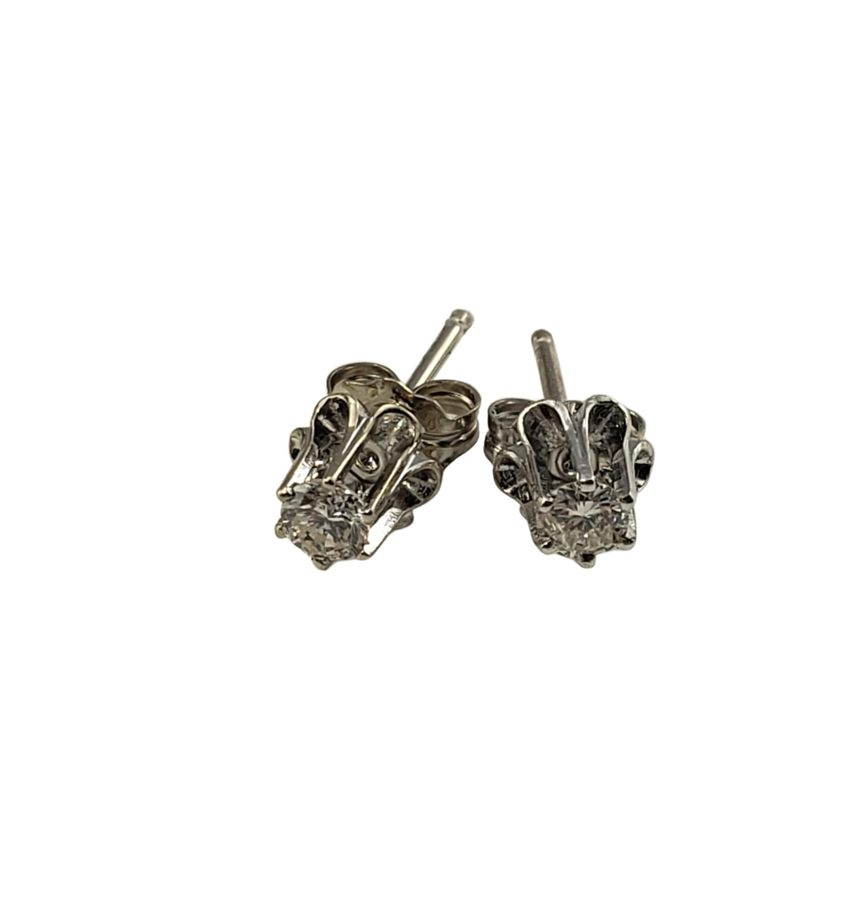 Vintage 14 Karat White Gold Diamond Stud Earrings .16 TCW-

These sparkling earrings each feature one round brilliant cut diamond set in classic 14K white gold.  Push back closures.

Approximate total diamond weight:  .16 ct.

Diamond color: