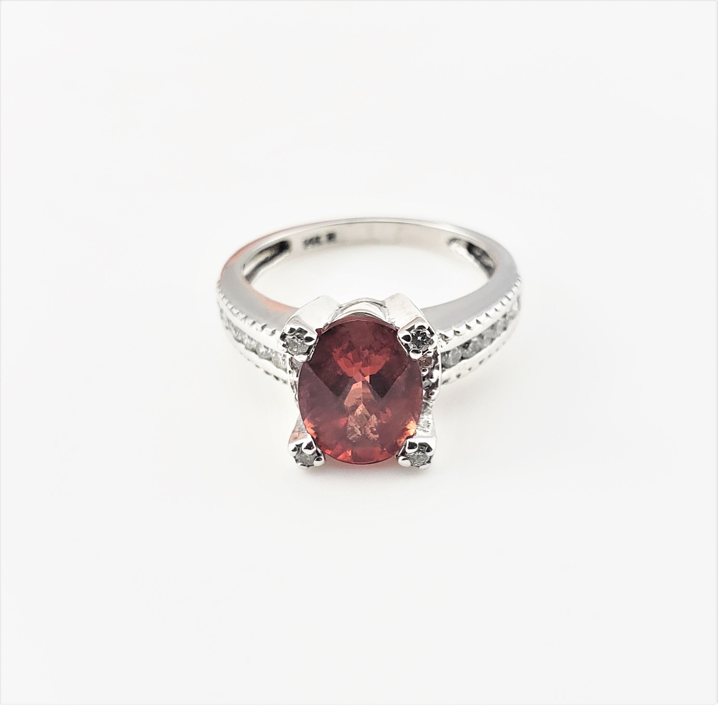 14 Karat White Gold Garnet and Diamond Ring Size 5.5  GAI Certified-

This lovely ring features one cushion rose cut garnet (2.05 ct.) and 20 round brilliant cut diamonds set in beautifully detailed 14K white gold.  Top of ring measures 9 mm x 9 mm.