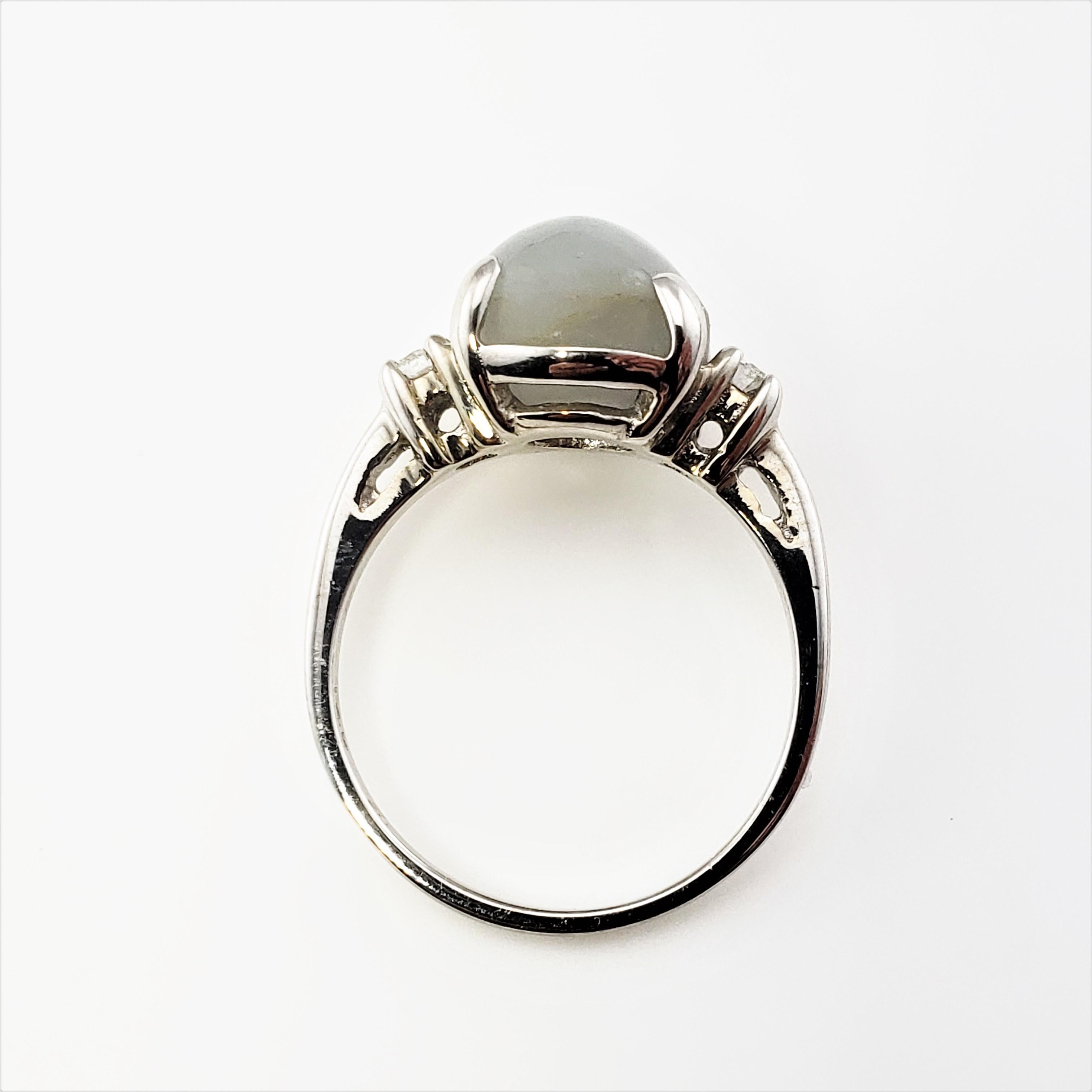 Round Cut 14 Karat White Gold Grey Cabochon Star Sapphire and Diamond Ring