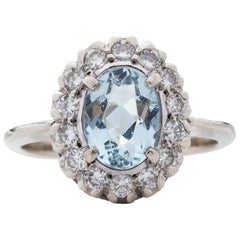 Vintage 14 Karat White Gold Oval Cut Aqua with a Diamond Halo, circa 1970s