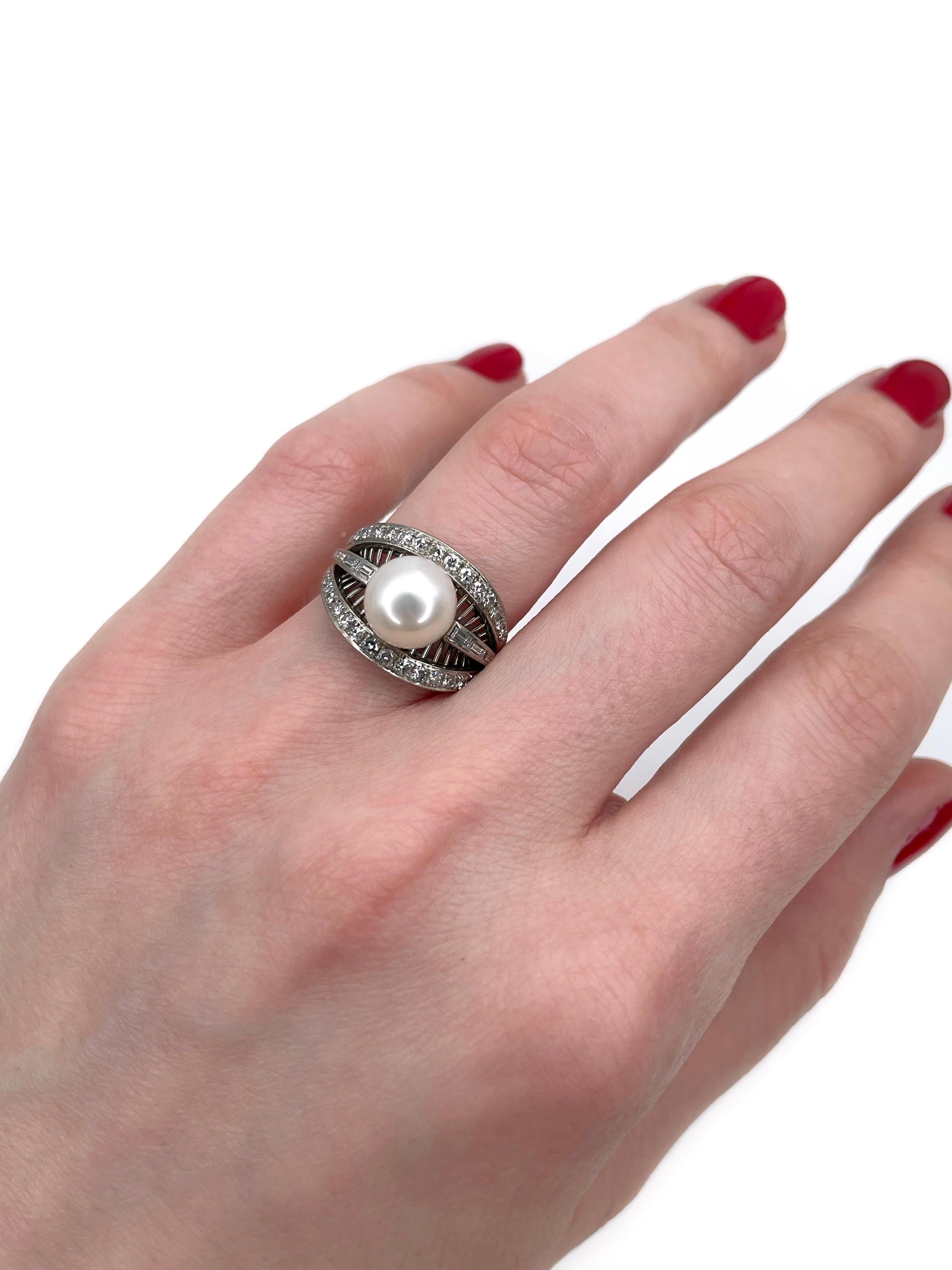 This is a vintage openwork cocktail ring crafted in 14K white gold. Circa 1960. 

The piece features:
- 1 cultured pearl
- 28 diamonds, RBC-17, TW 0.42ct, RW-W, VS-SI
- 6 diamonds, rectangular step cut, TW 0.07ct, RW-W, VS

Weight: 4.92g
Size: 15.25