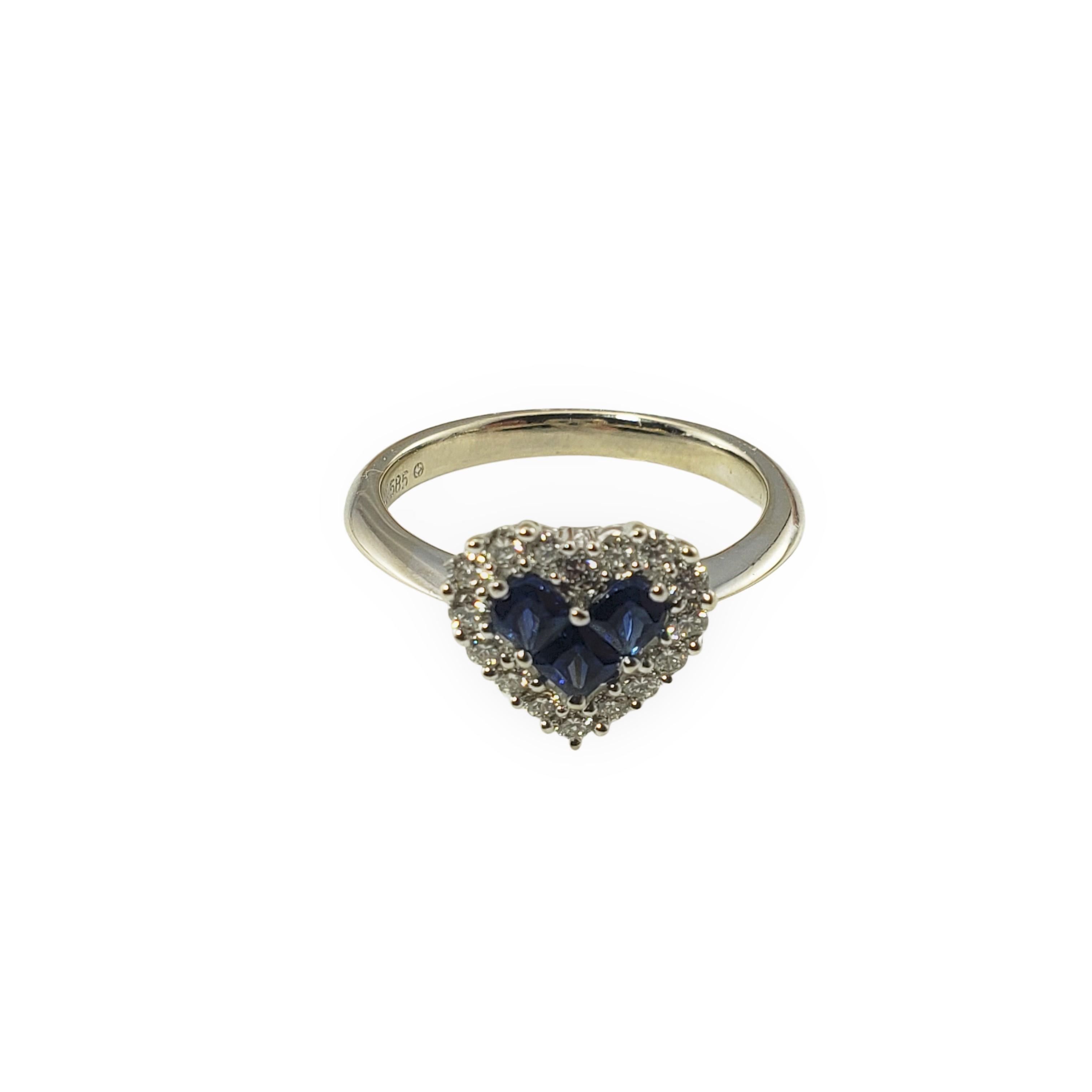 Vintage 14 Karat White Gold Natural Sapphire and Diamond Heart Ring Size 7-

This lovely heart ring features 16 round brilliant cut diamonds and three natural sapphires set in classic 14K white gold.  Width:  10 mm.
Shank:  2.5 mm.

Approximate