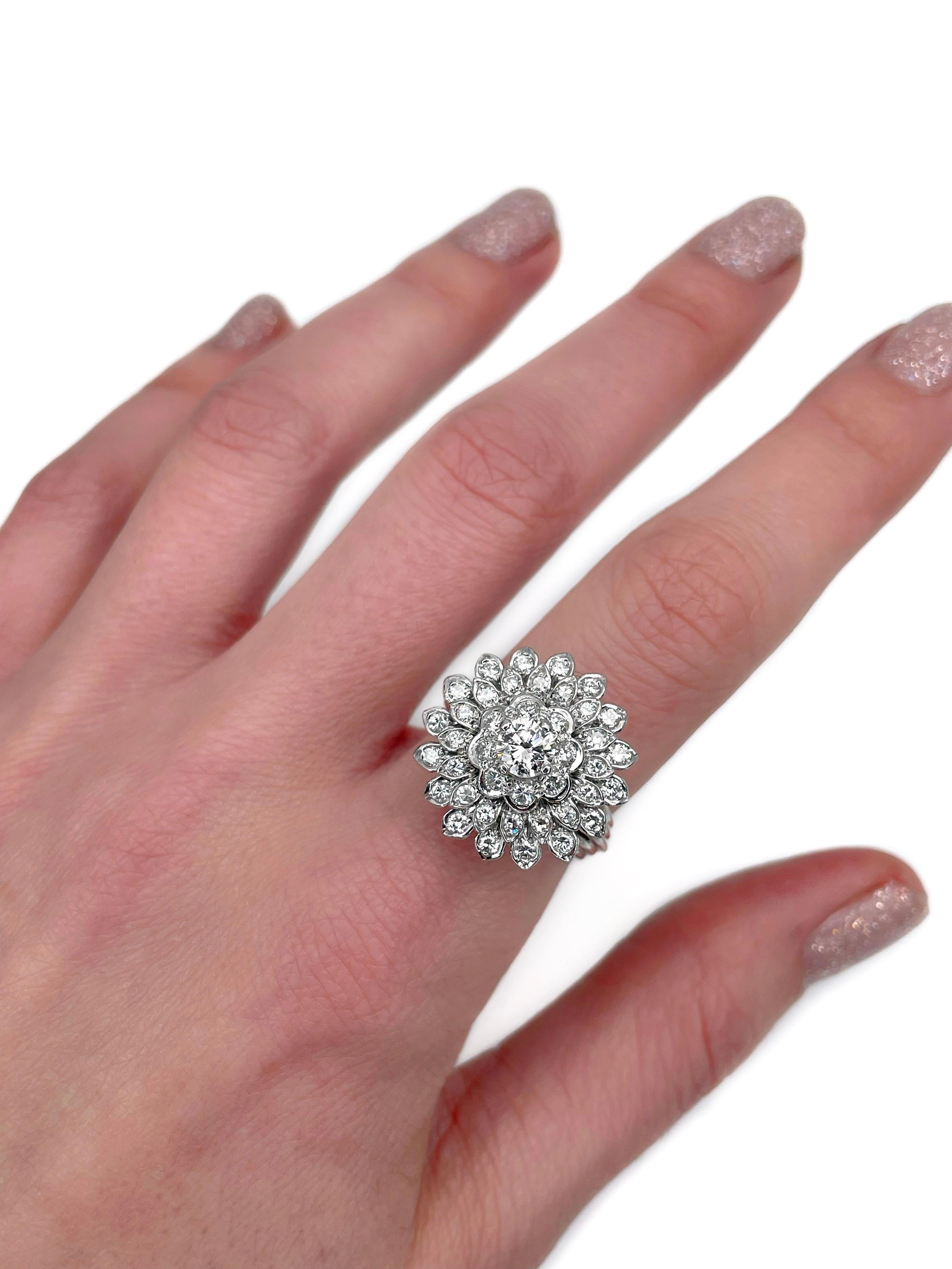 This is a vintage cocktail ring crafted in 14K white gold. Circa 1980.

 It features diamonds (TW 1.27ct):
- 1pc., brilliant cut, 0.45ct, RW, VS2
- 8pcs.,  RBC-17, TW 0.12ct, RW+/RW, VS-SI
- 32pcs., brilliant cut, TW 0.70ct, RW+/RW, VS-SI

Weight: